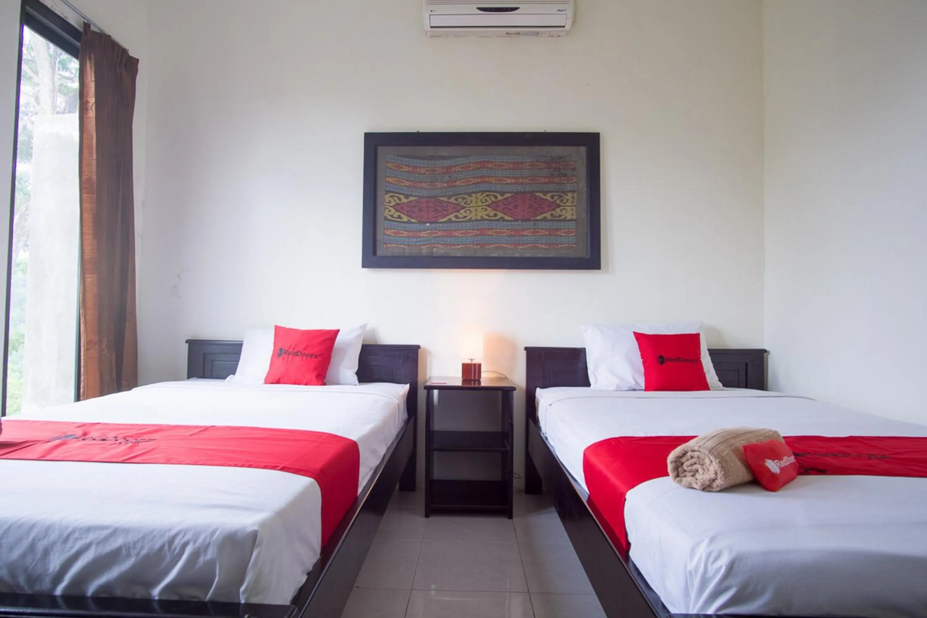 Bed in RedDoorz Syariah near Ngade Lake Ternate