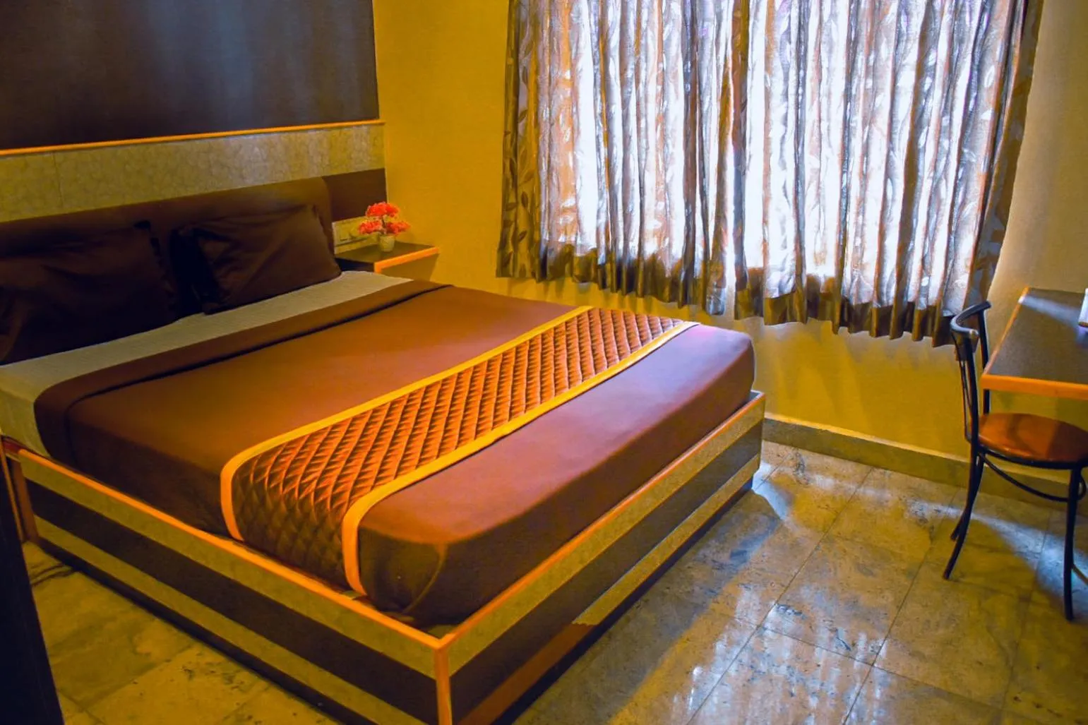 Photo of the whole room, Bed in Madurai Grands Inn
