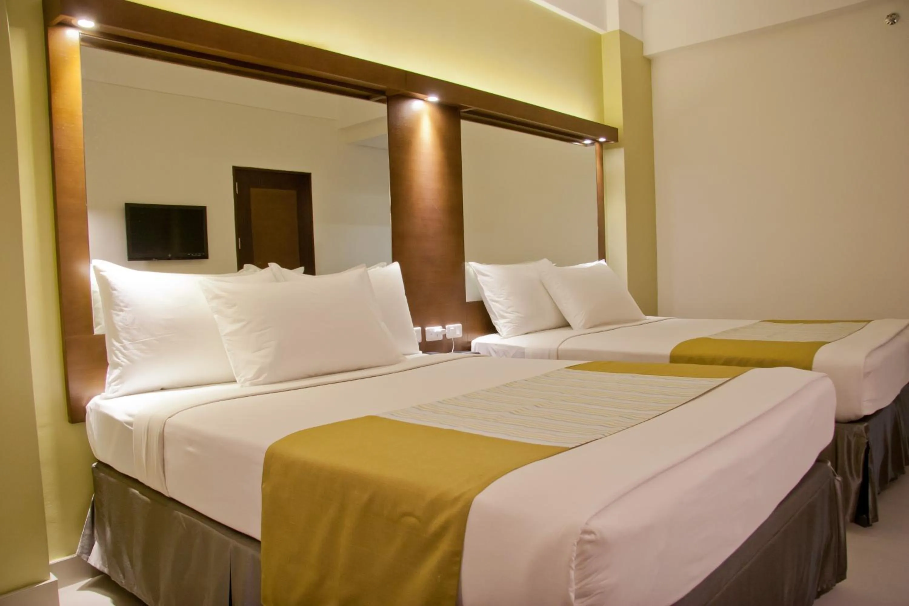 Photo of the whole room, Bed in Microtel by Wyndham Acropolis