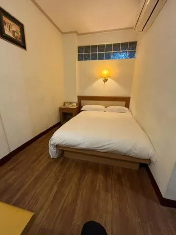 Bed in 金馬大飯店 Riverside Hotel