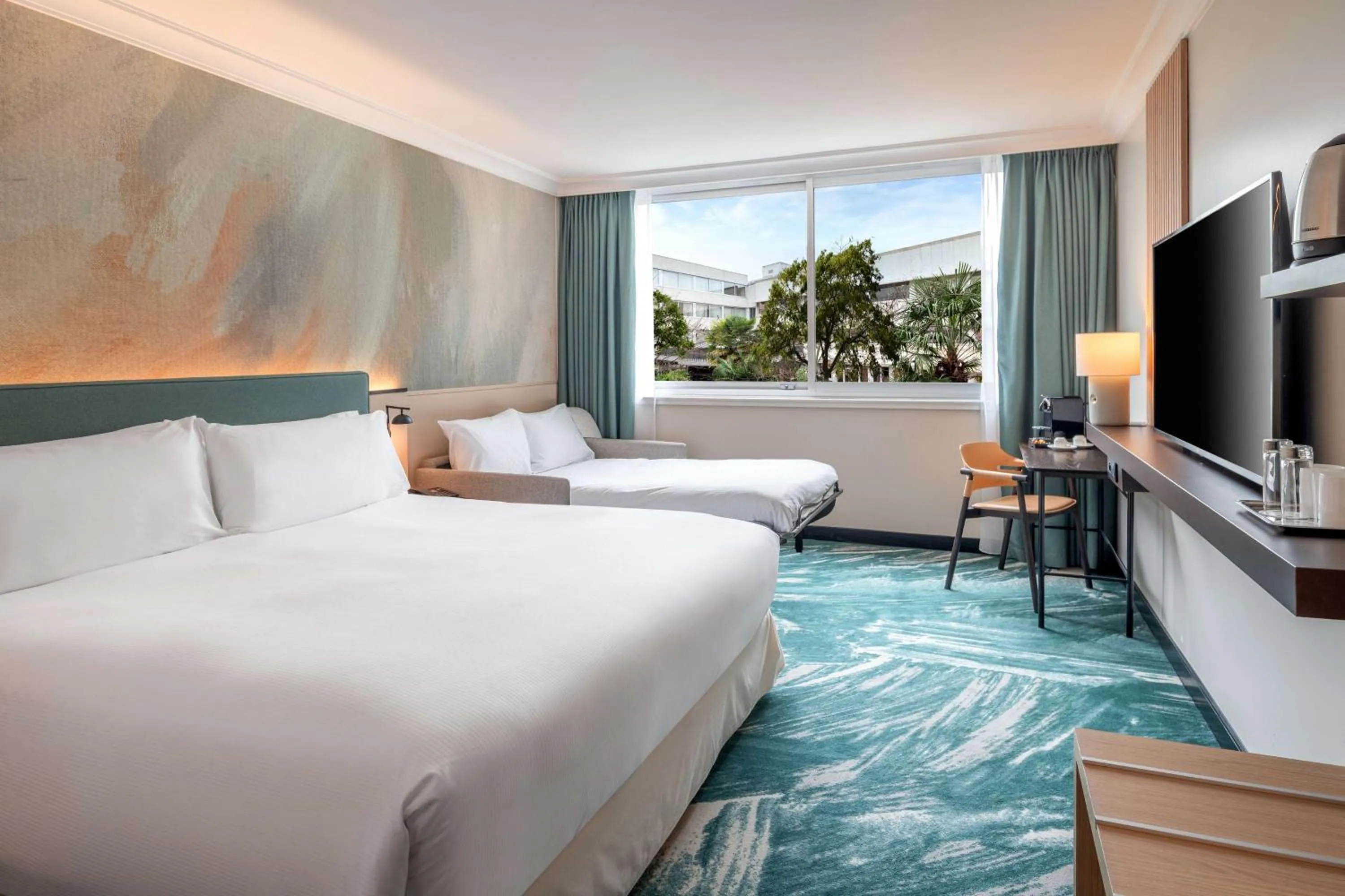 Living room, Bed in DoubleTree by Hilton Paris Bougival