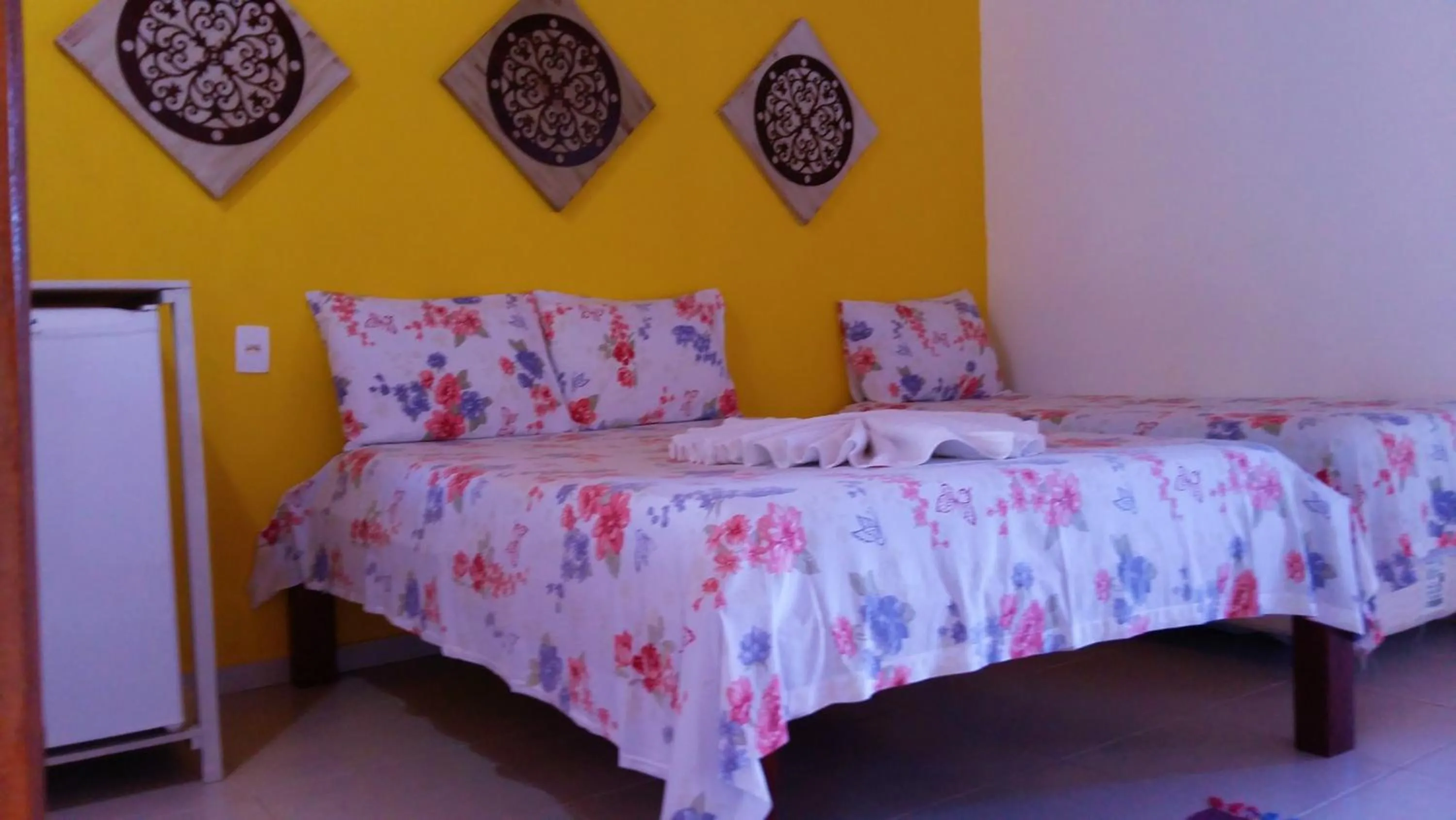 Bed in Pousada Água Viva