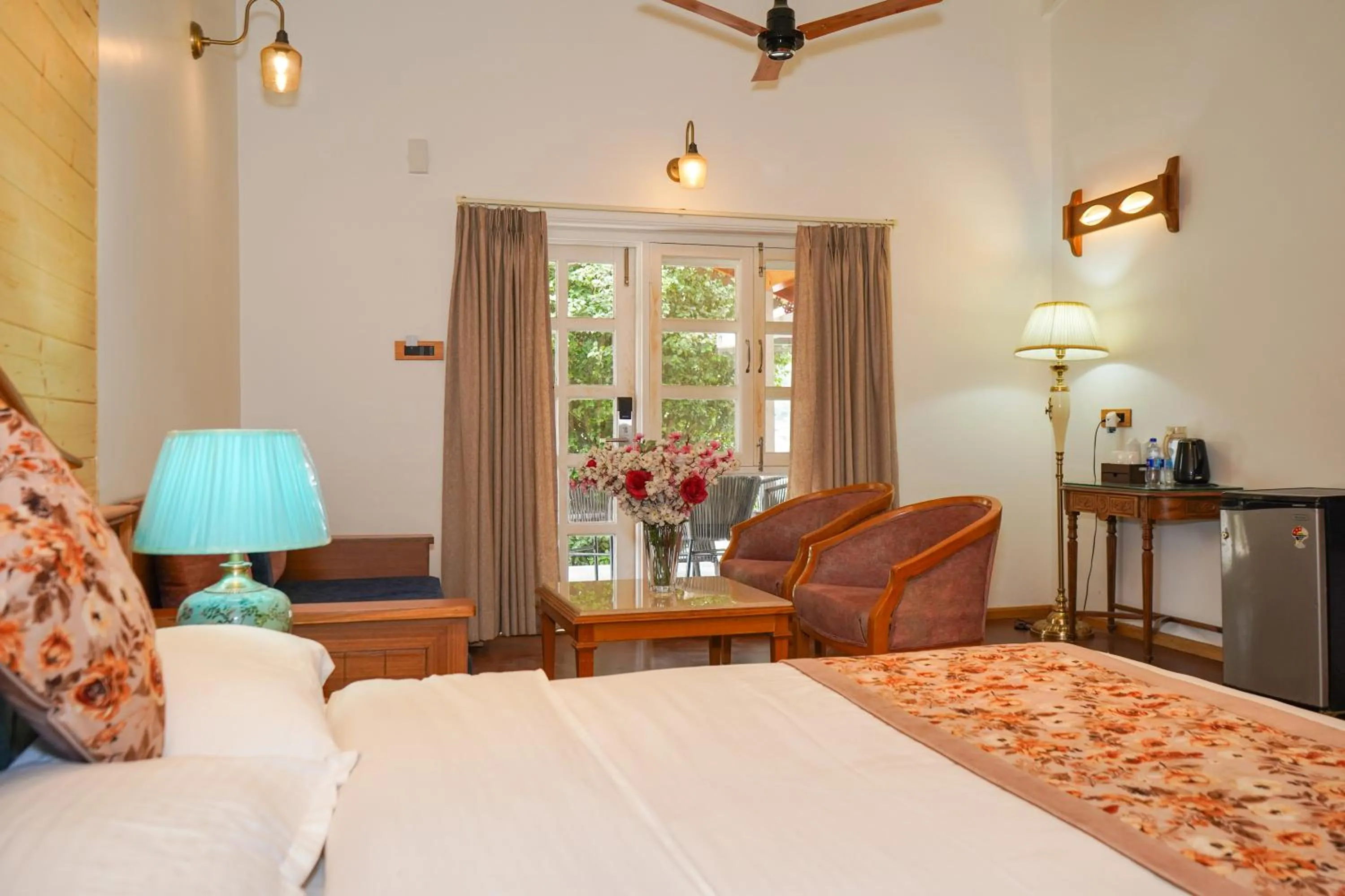 Seating area, Bed in Neelesh Inn- A Luxury Lake View Hotel- 20 kms from Nainital