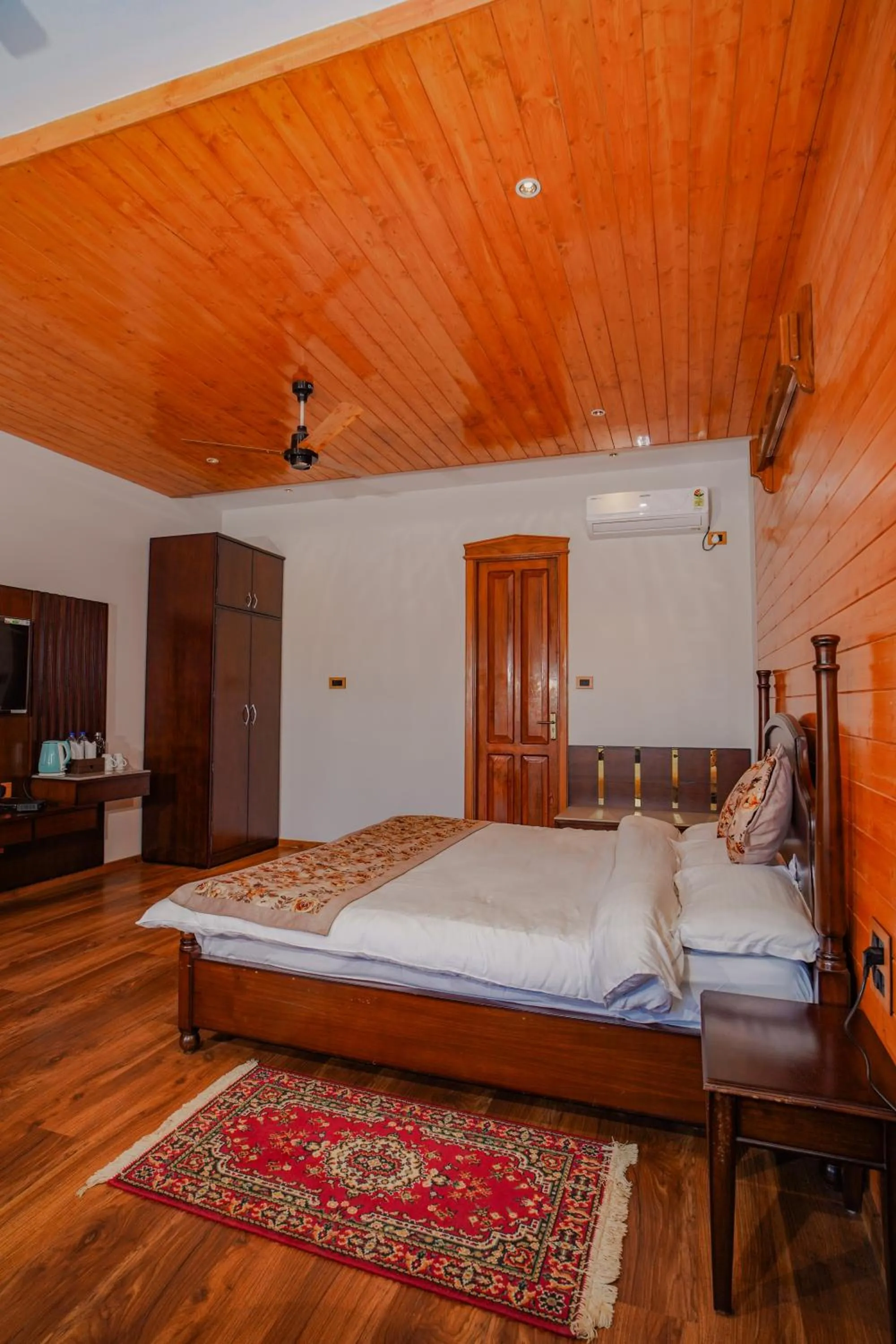 Photo of the whole room, Bed in Neelesh Inn- A Luxury Lake View Hotel- 20 kms from Nainital