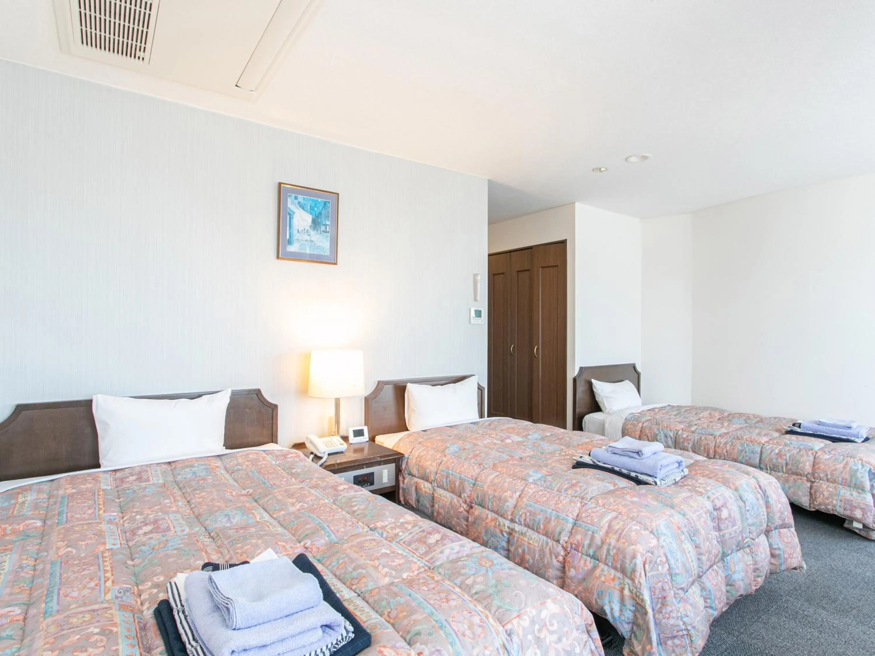 Bed in Aqua Garden Hotel Fukumaru