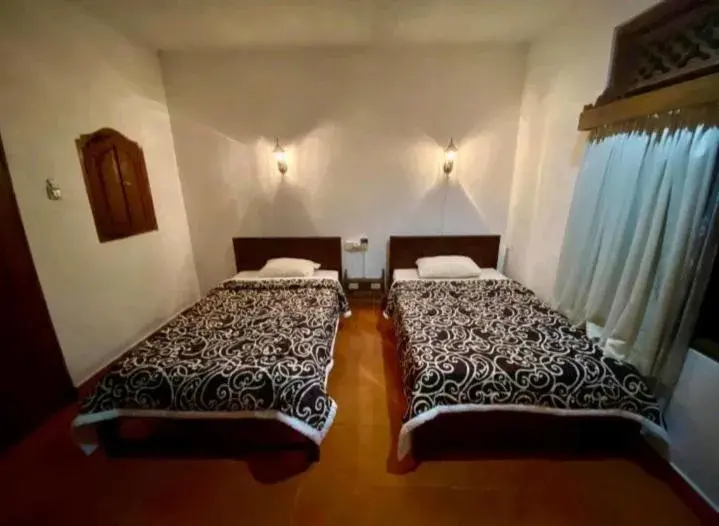 Standard Twin Room with AC in Puri Bebengan Bungalows Standard Twin Room with AC in Puri Bebengan Bungalows