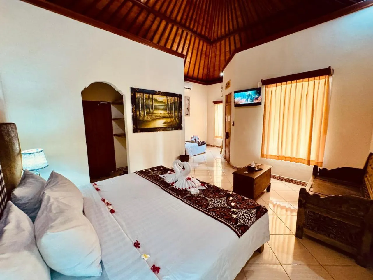 Communal lounge/ TV room, Bed in Bungalow Geringsing