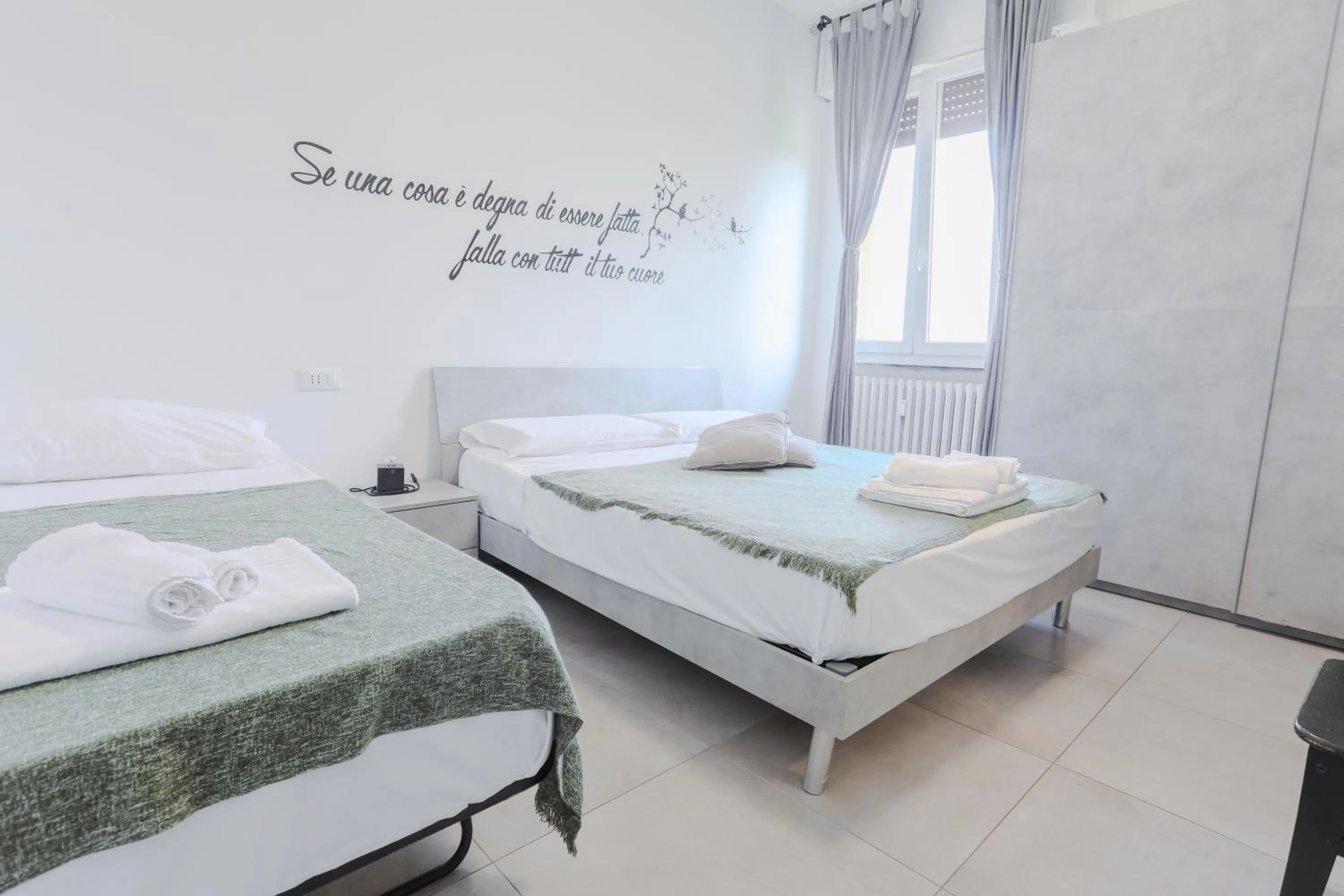 Bed in HOLABOLOGNA Luxury Rooms and Flats