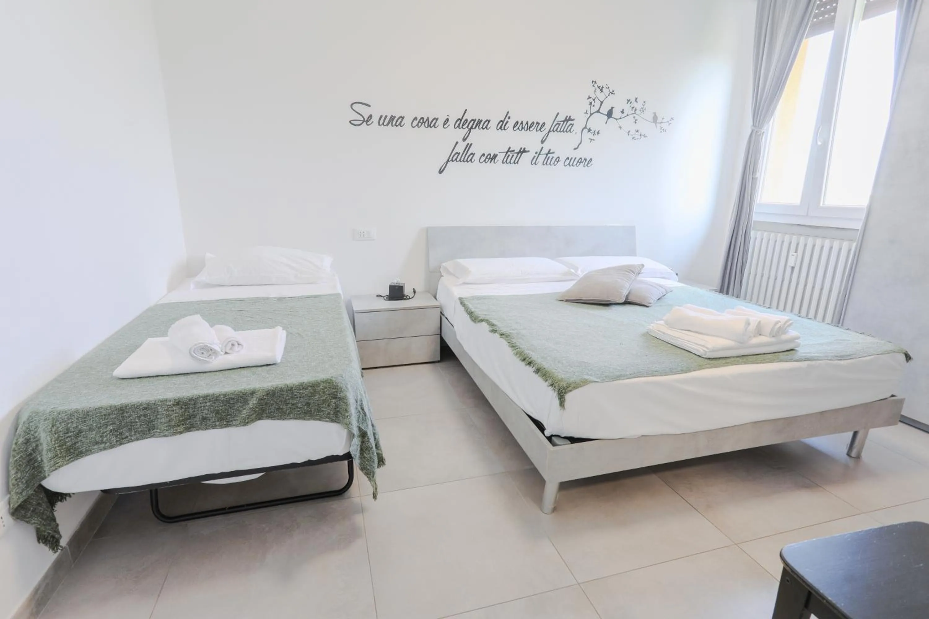 Bed in HOLABOLOGNA Luxury Rooms and Flats