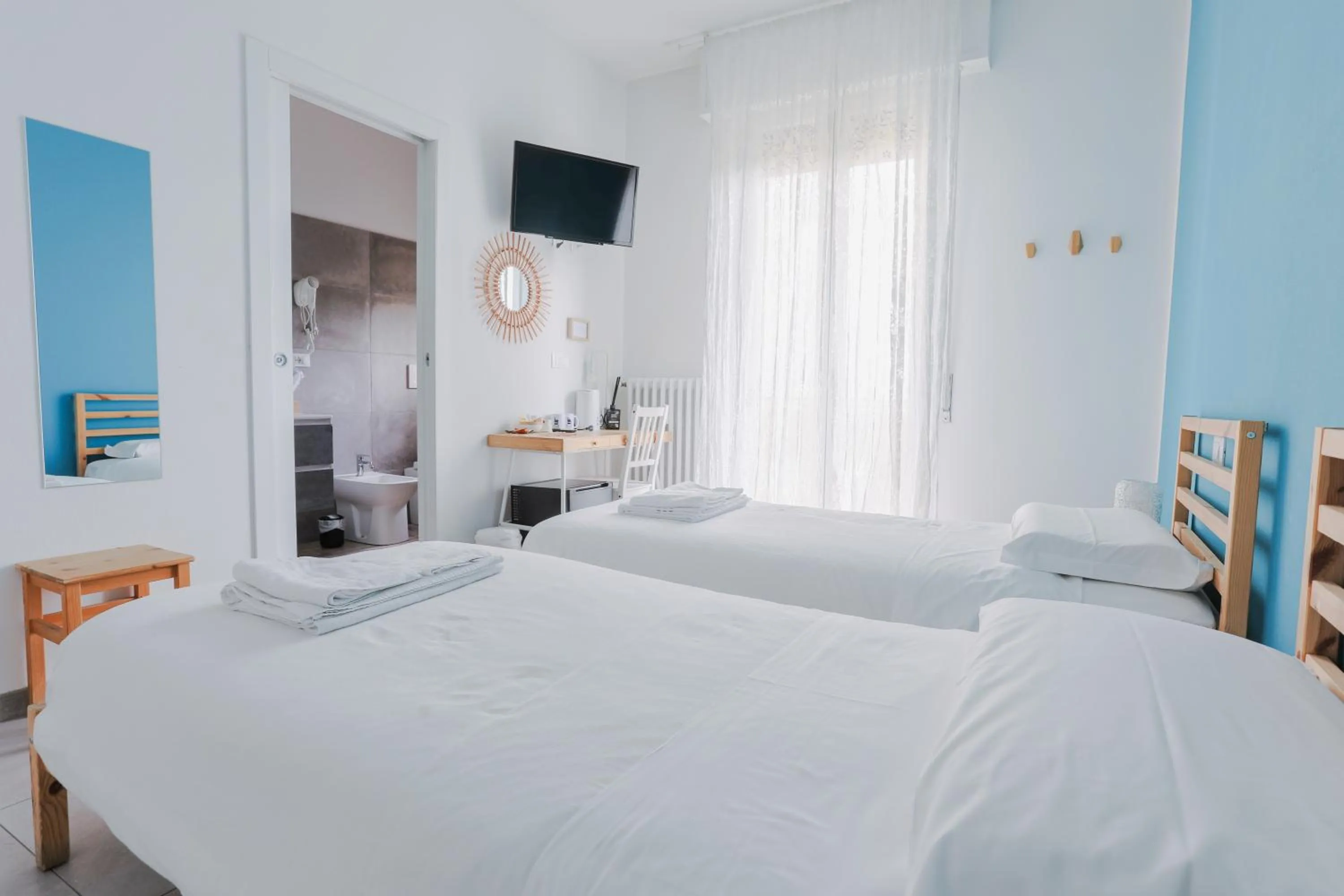 Bed in HOLABOLOGNA Luxury Rooms and Flats