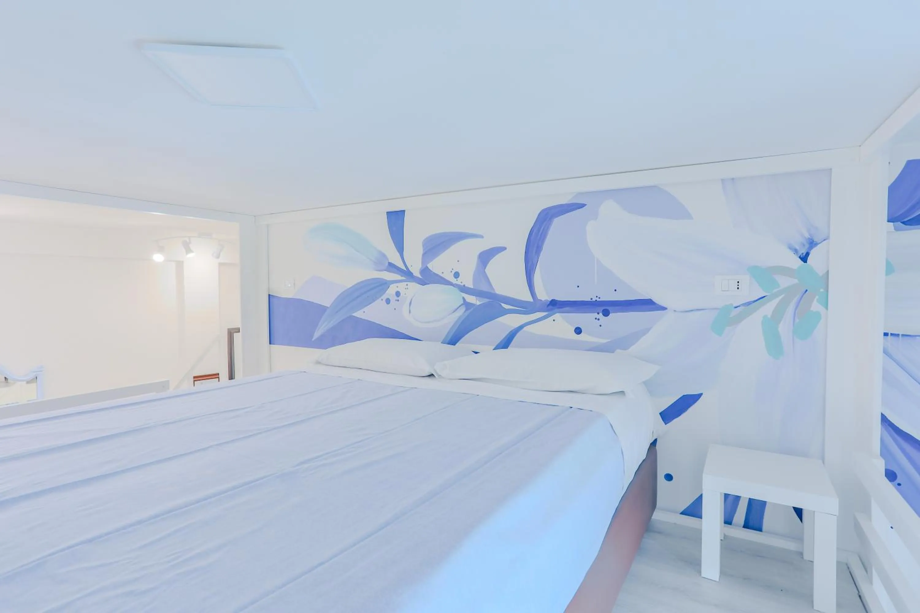 Bed in HOLABOLOGNA Luxury Rooms and Flats