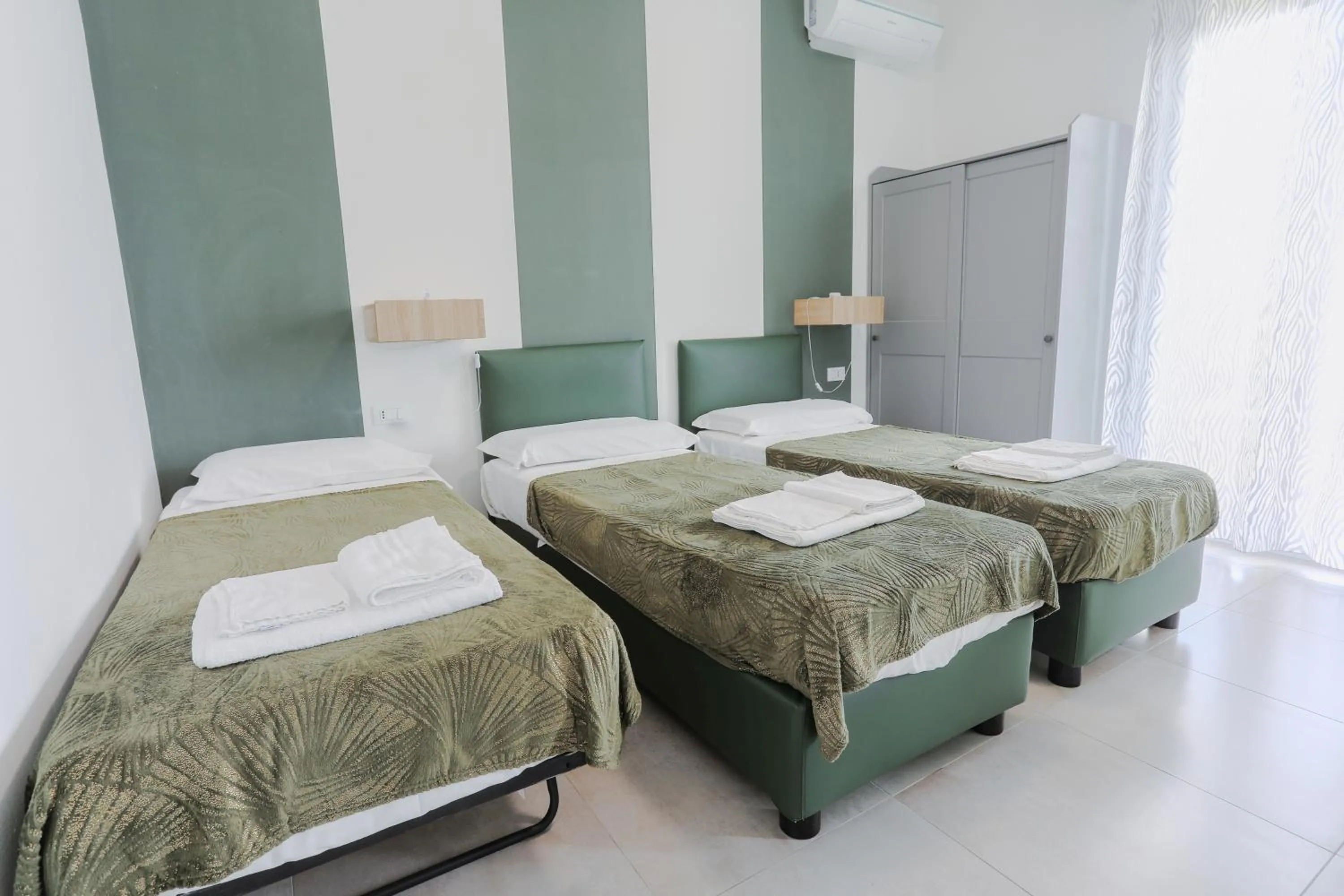 Bed in HOLABOLOGNA Luxury Rooms and Flats