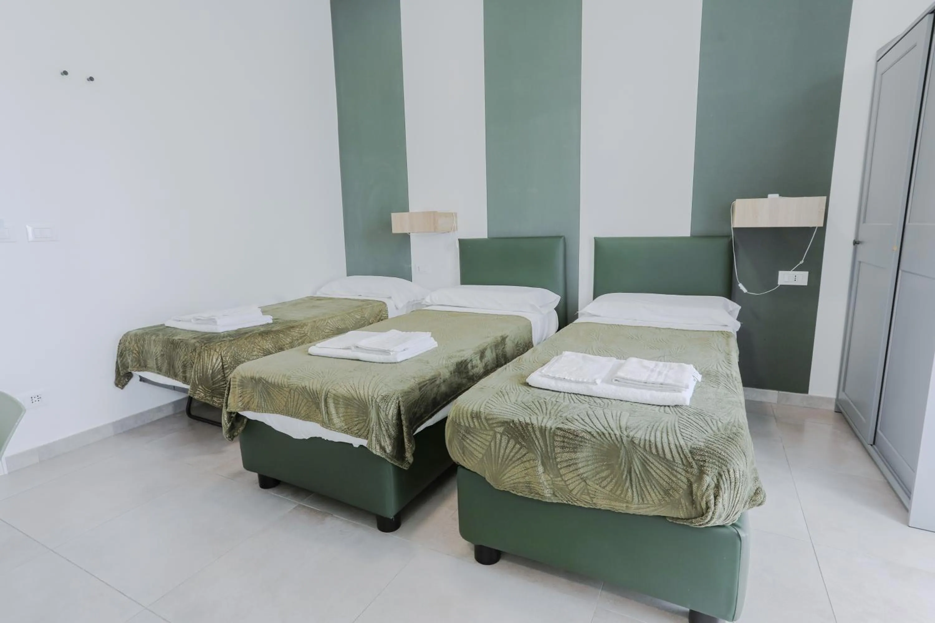 Bed in HOLABOLOGNA Luxury Rooms and Flats