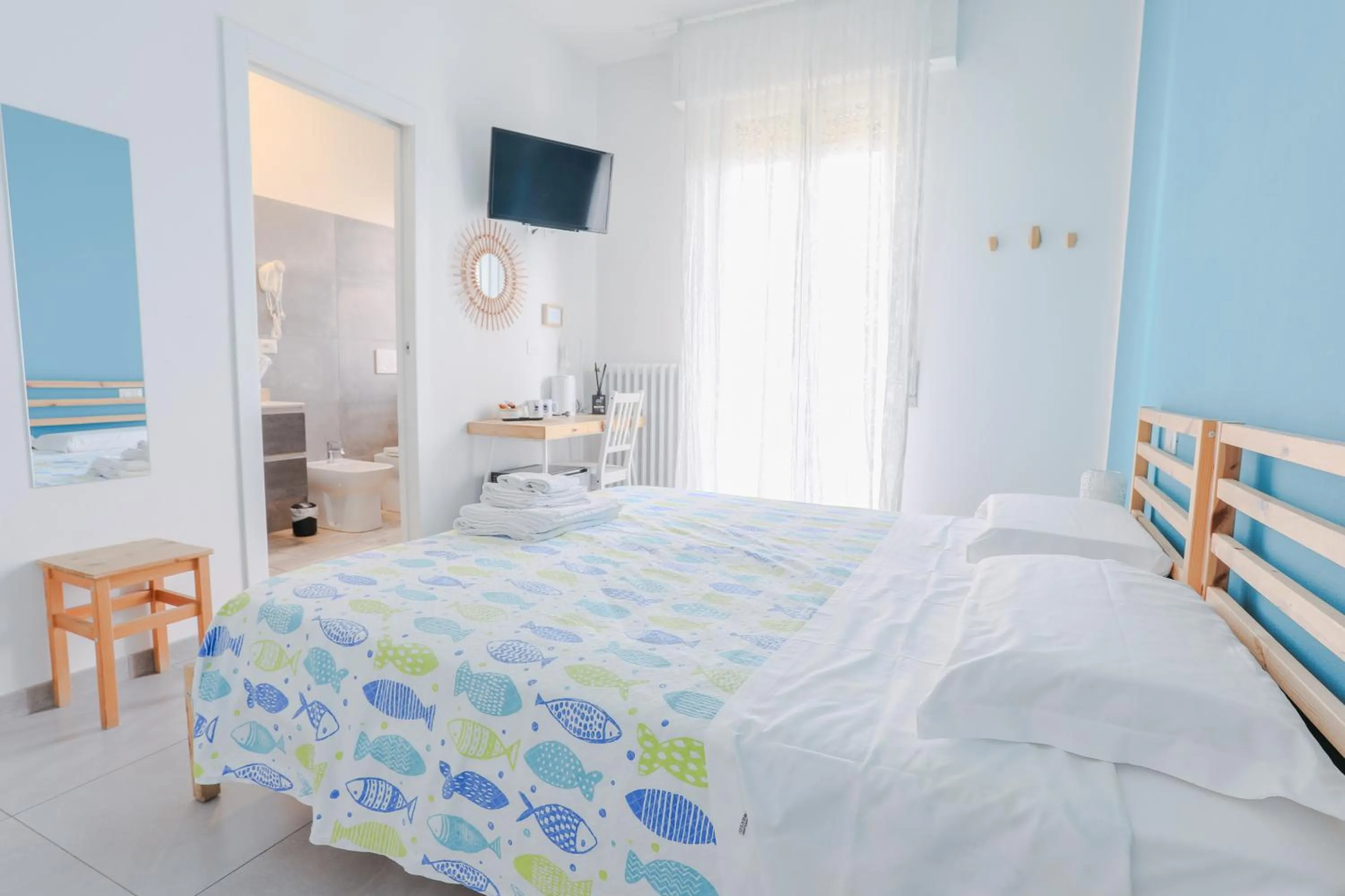 Bed in HOLABOLOGNA Luxury Rooms and Flats