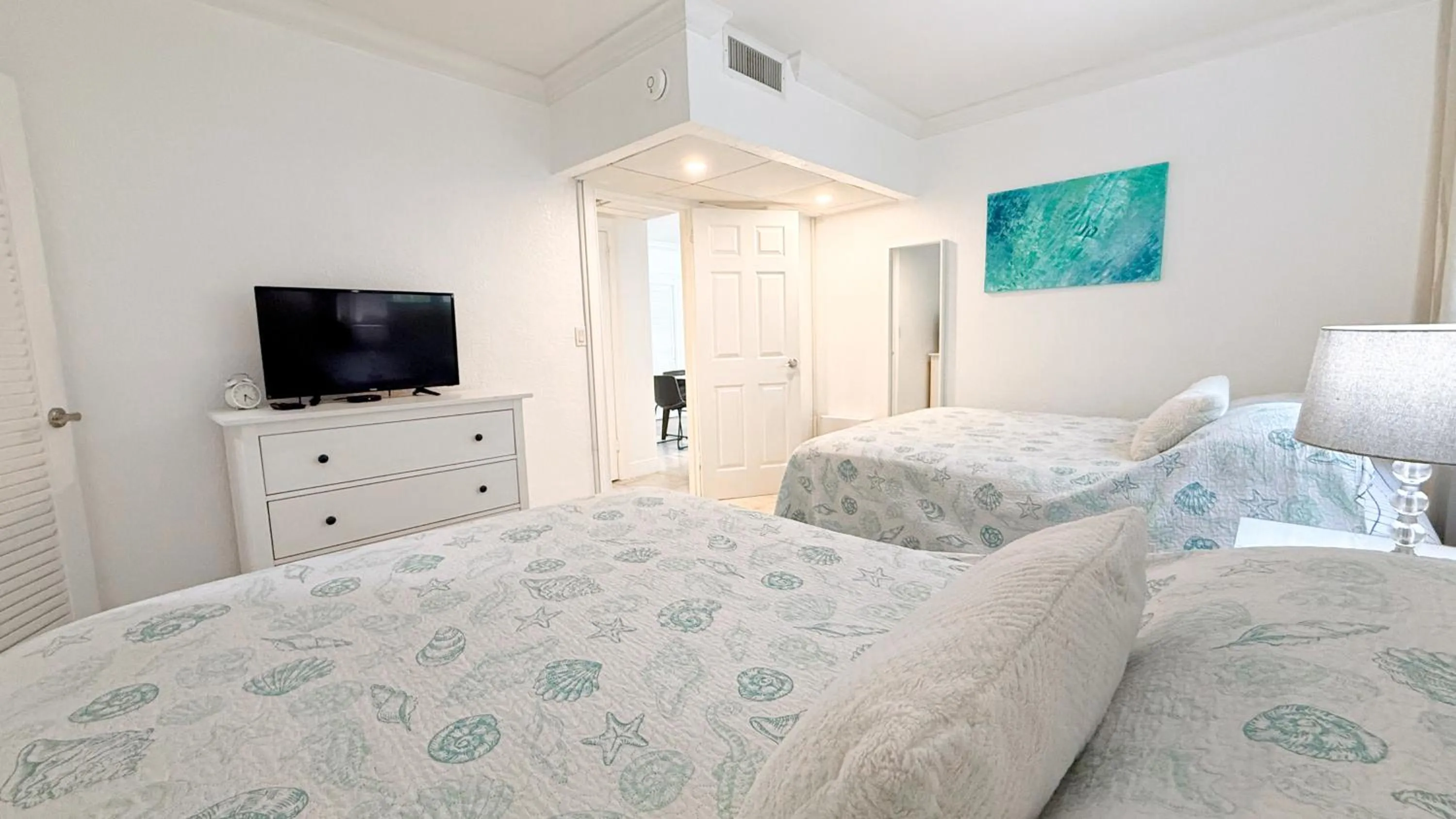Bedroom, Bed in The Tides Apartments on the beach