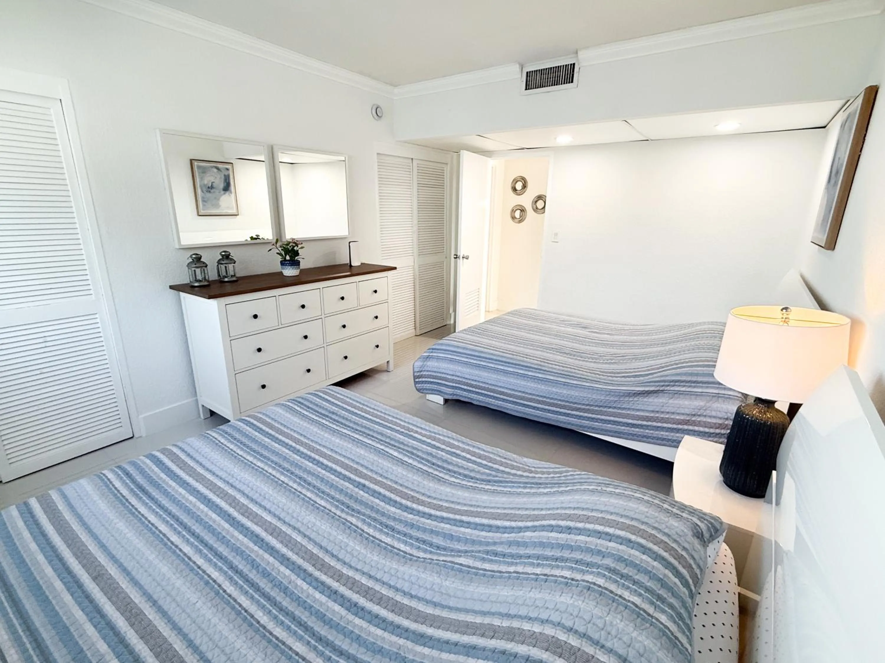 Bedroom, Bed in The Tides Apartments on the beach