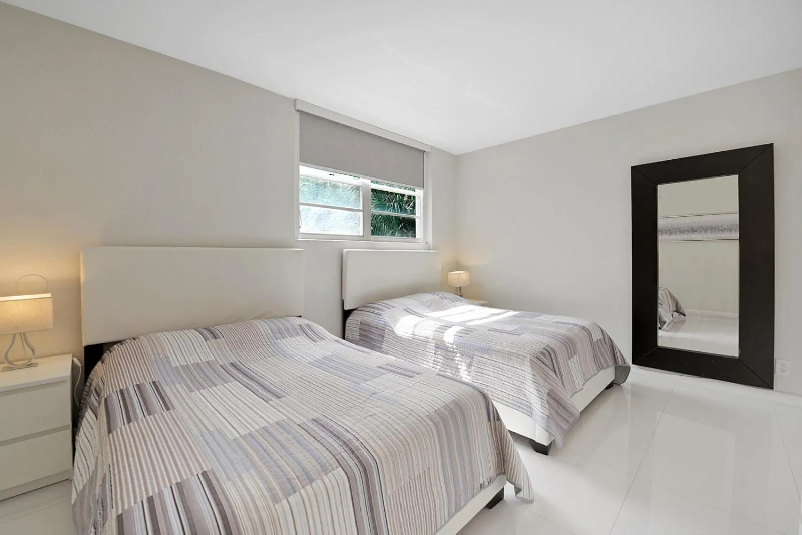 Bedroom, Bed in The Tides Apartments on the beach