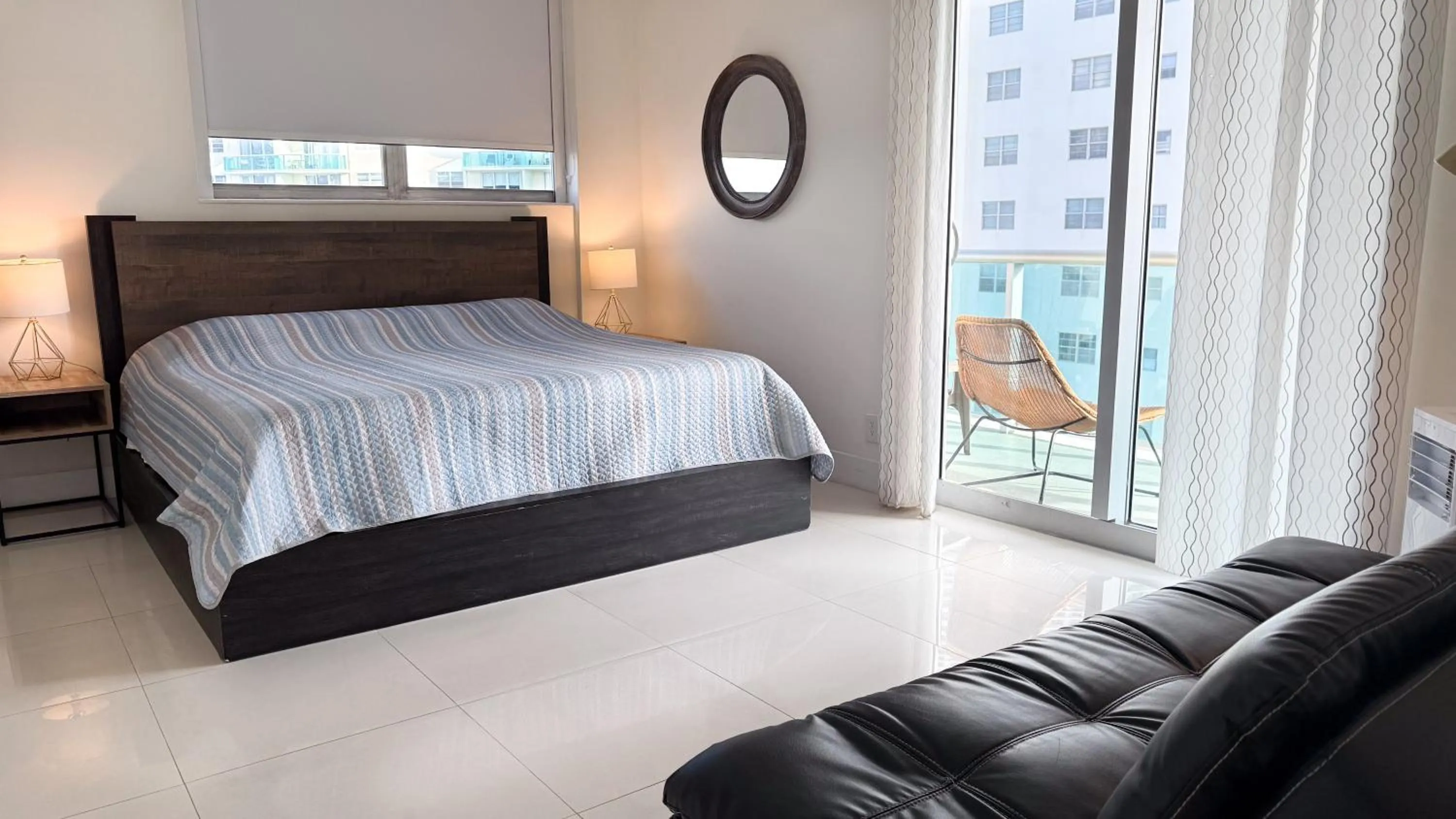 Balcony/Terrace, Bed in The Tides Apartments on the beach