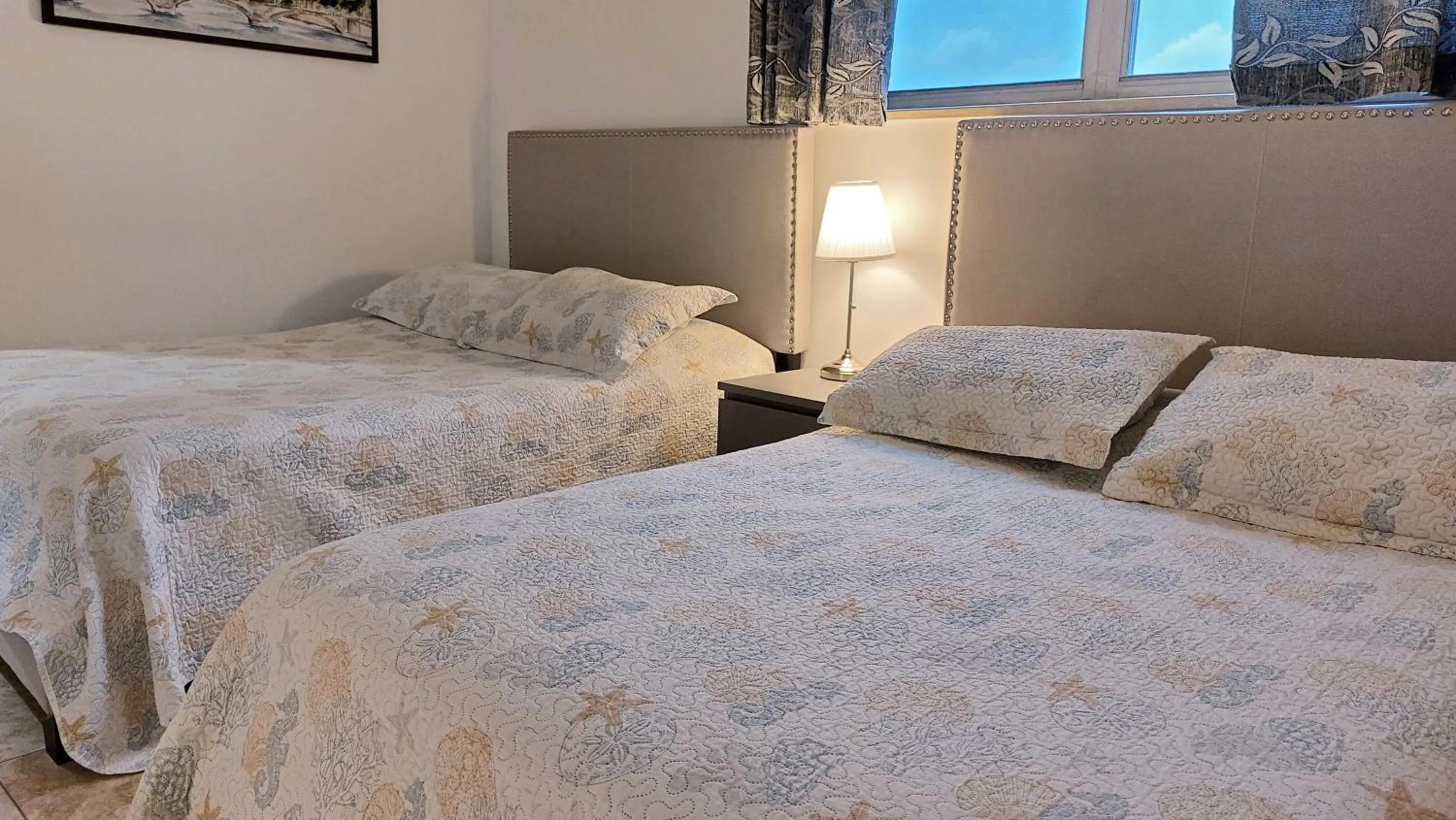 Bedroom, Bed in The Tides Apartments on the beach