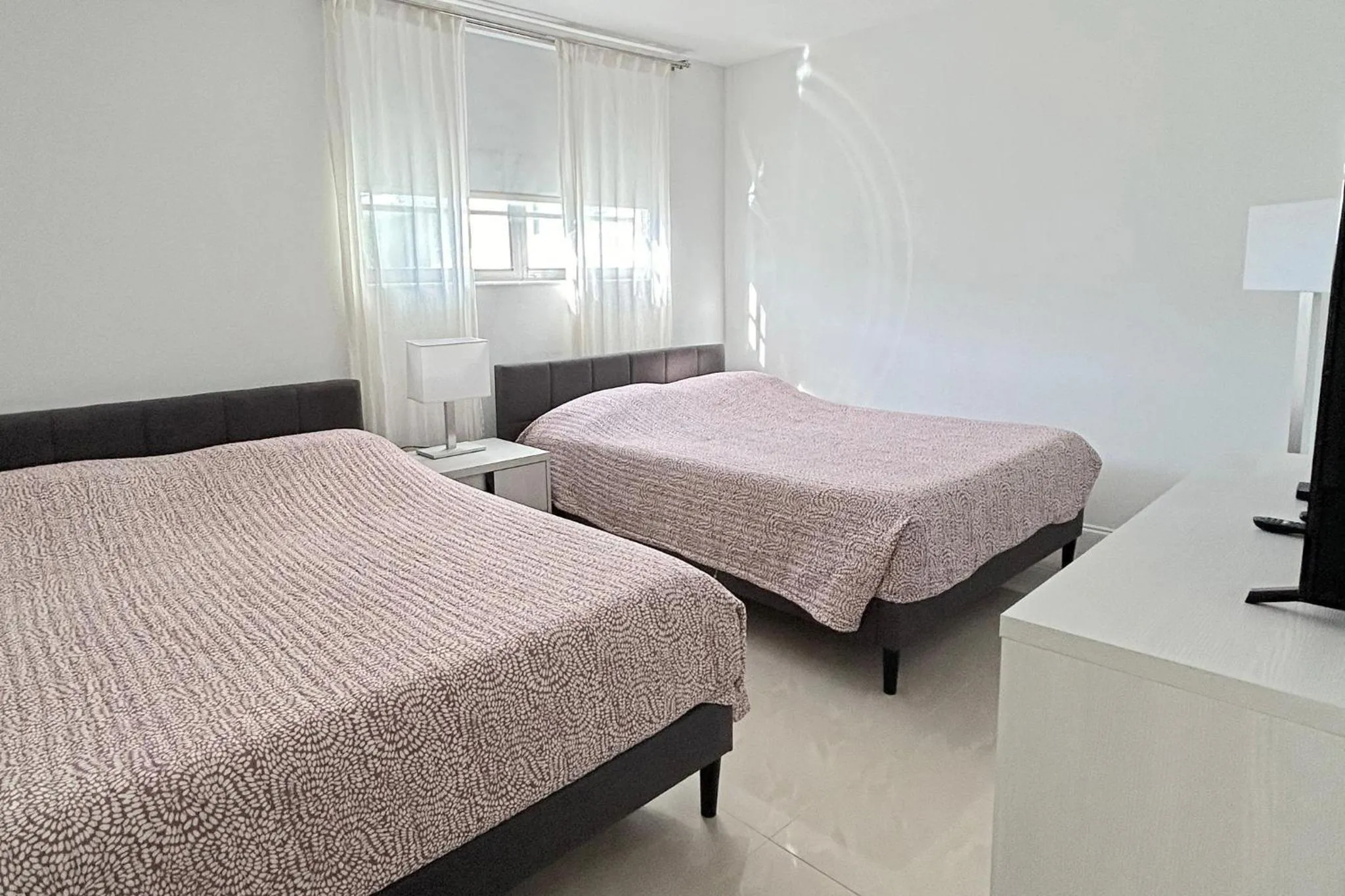 Bedroom, Bed in The Tides Apartments on the beach