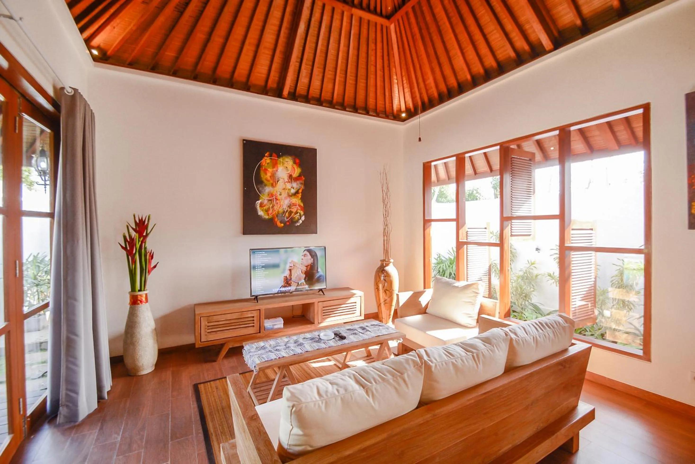 Communal lounge/ TV room, Bed in Villa Kupu Kupu Bingin