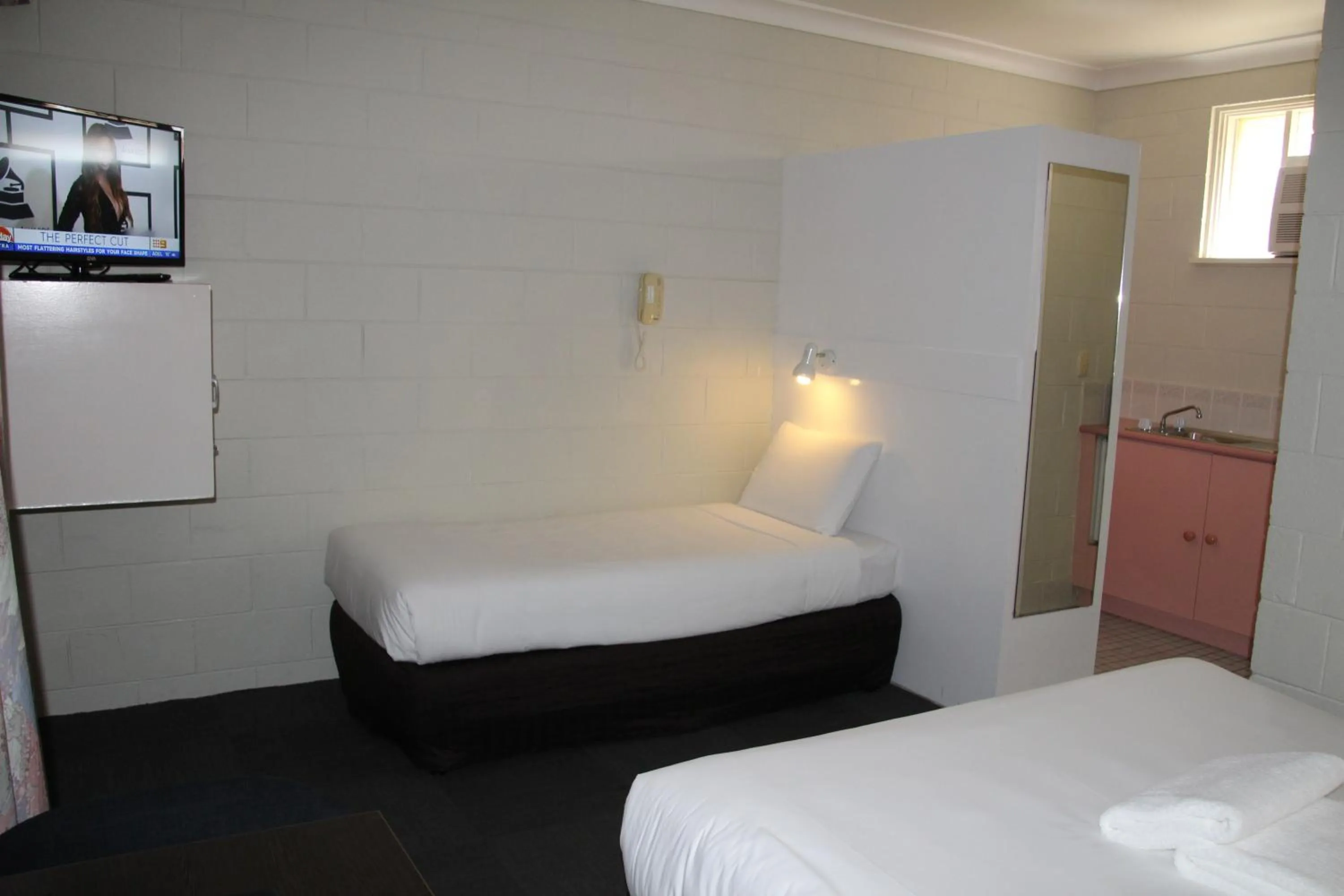 Bed in Central Coast Motel