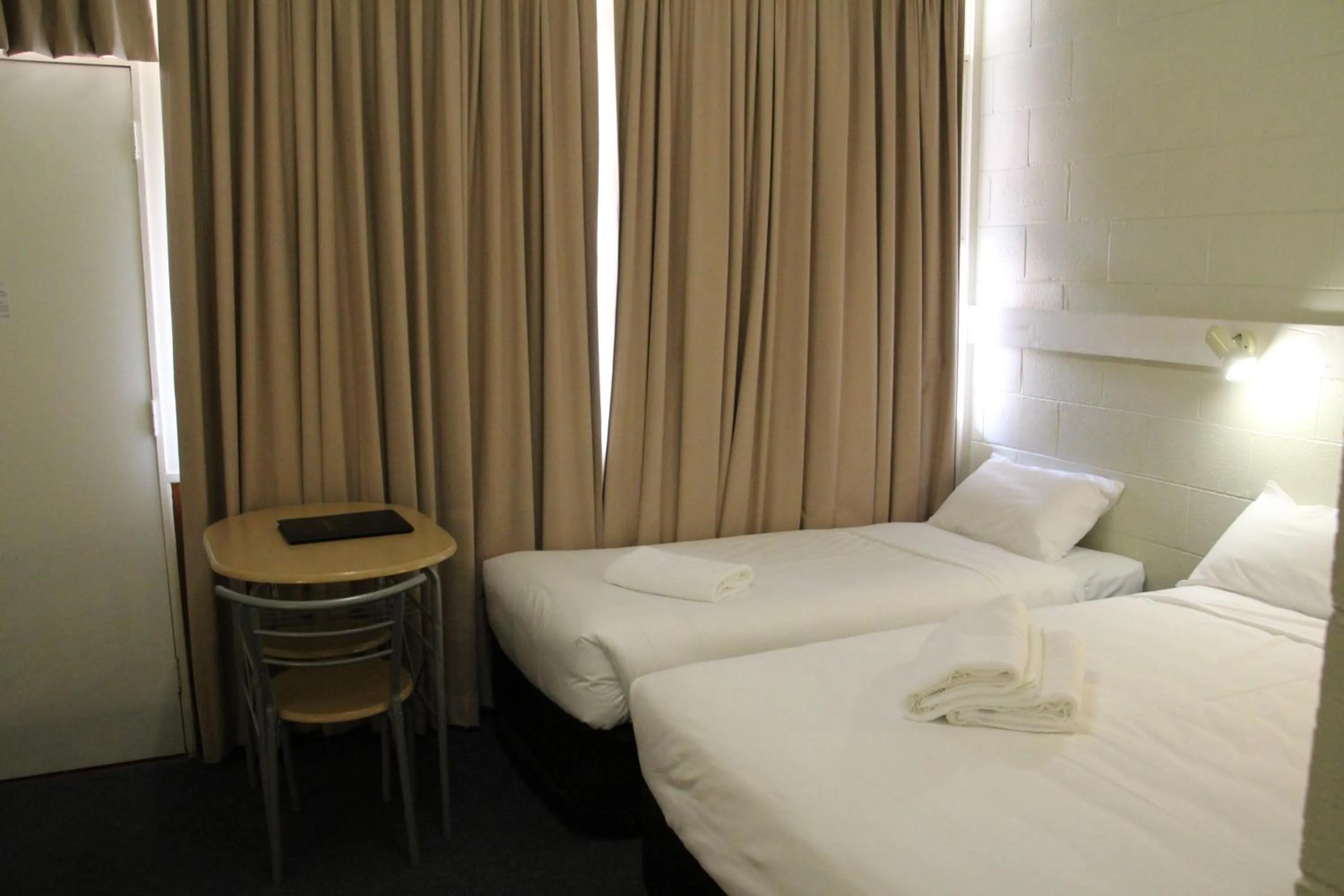 Bed in Central Coast Motel