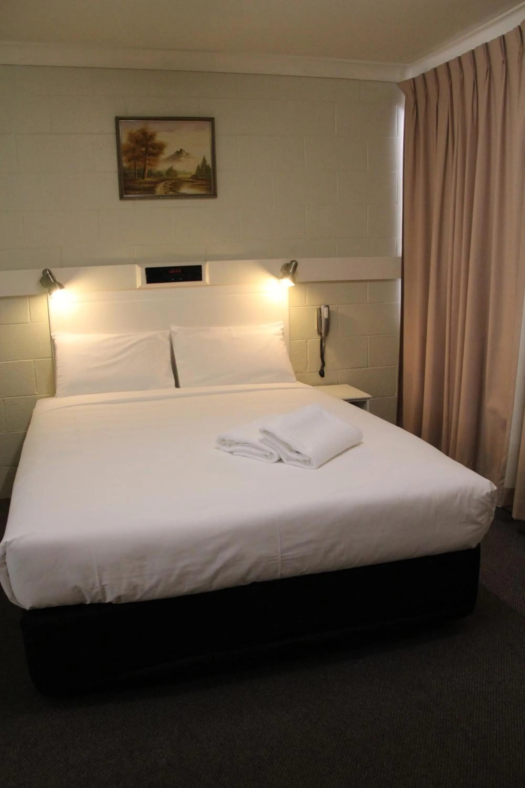 Bed in Central Coast Motel