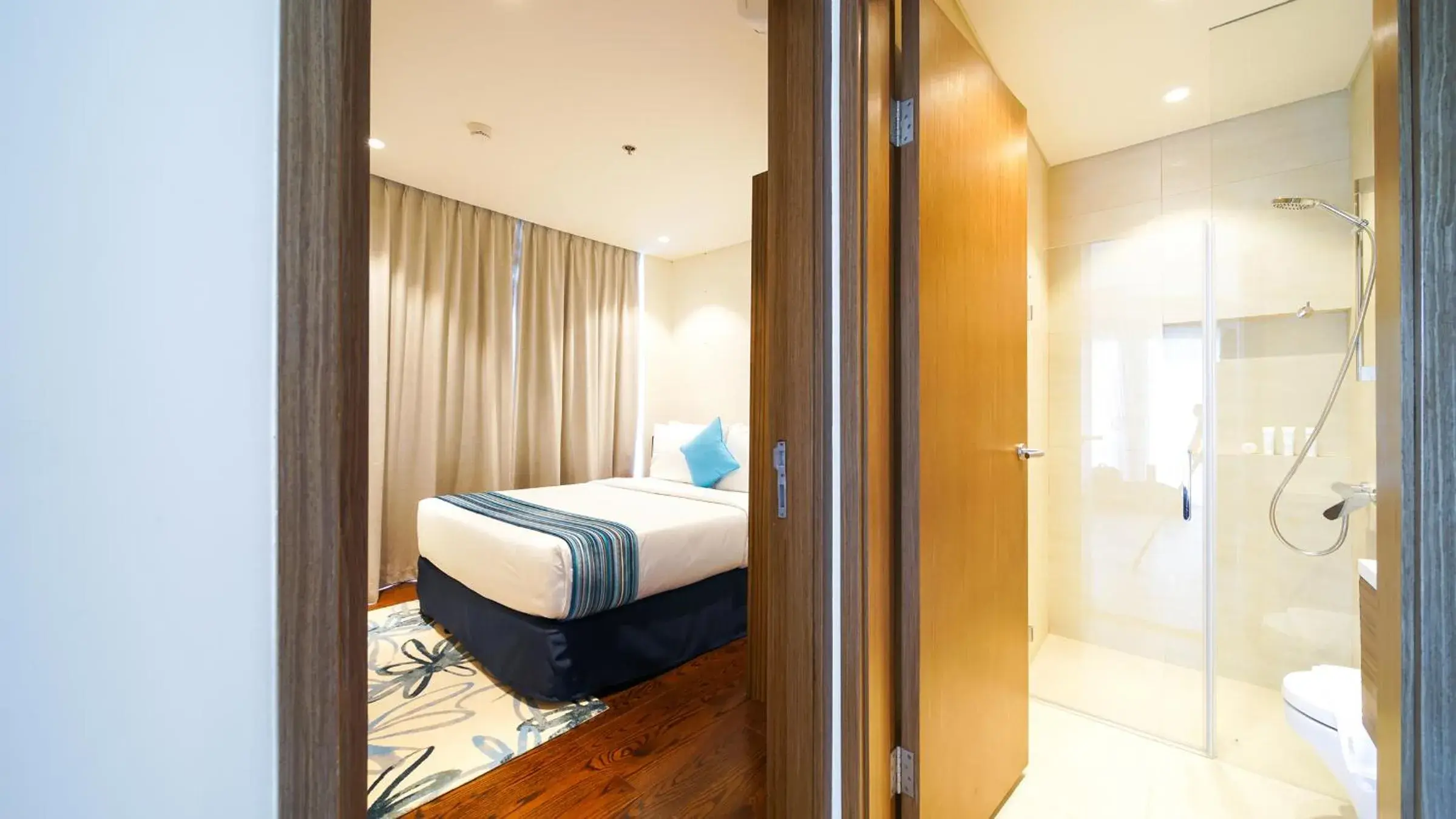 Shower, Bed in Tambuli Seaside Resort and Spa Shower, Bed in Tambuli Seaside Resort and Spa