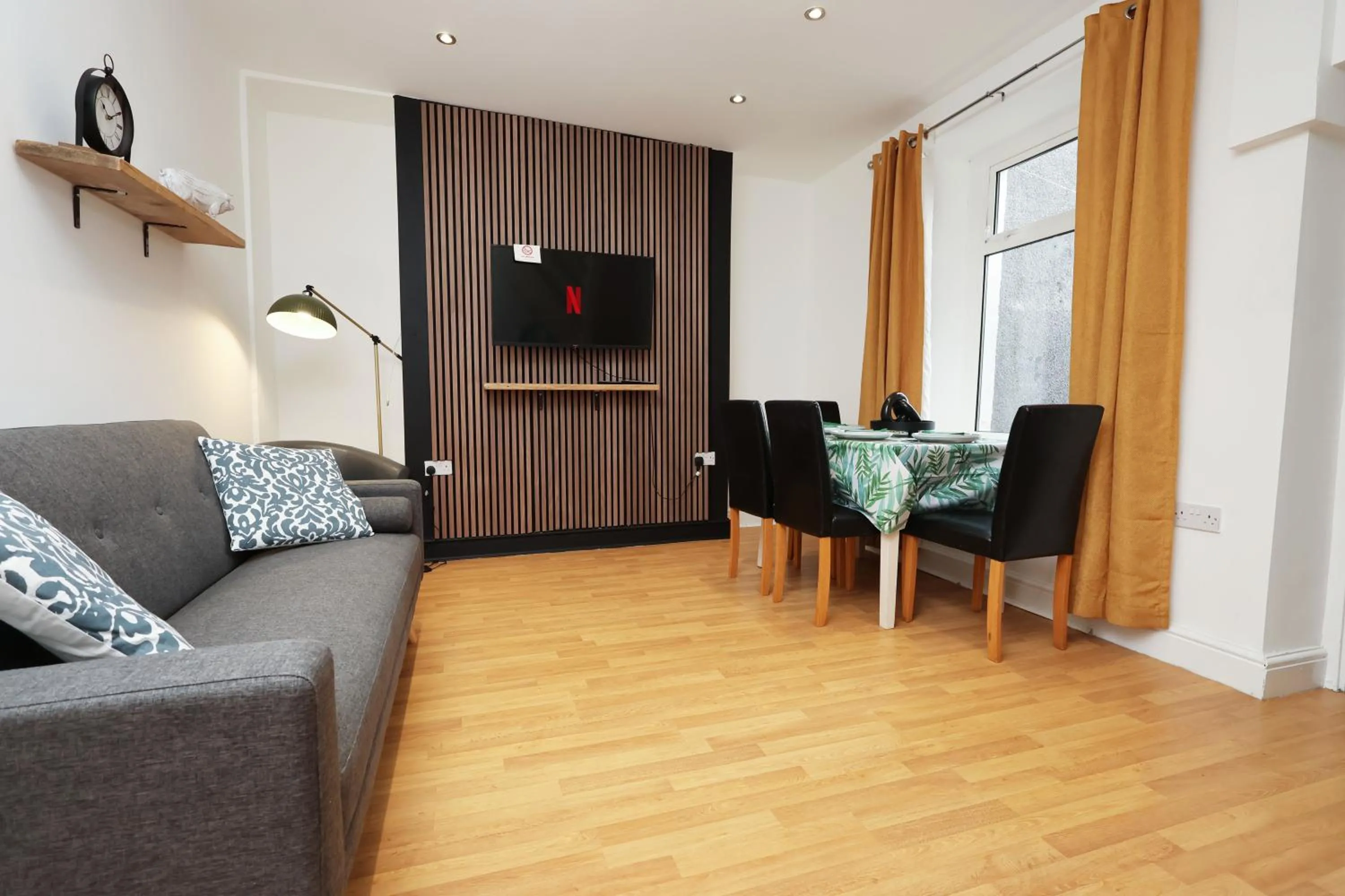 Communal lounge/ TV room in Contractor Stay - Deck - TVs in Every Room
