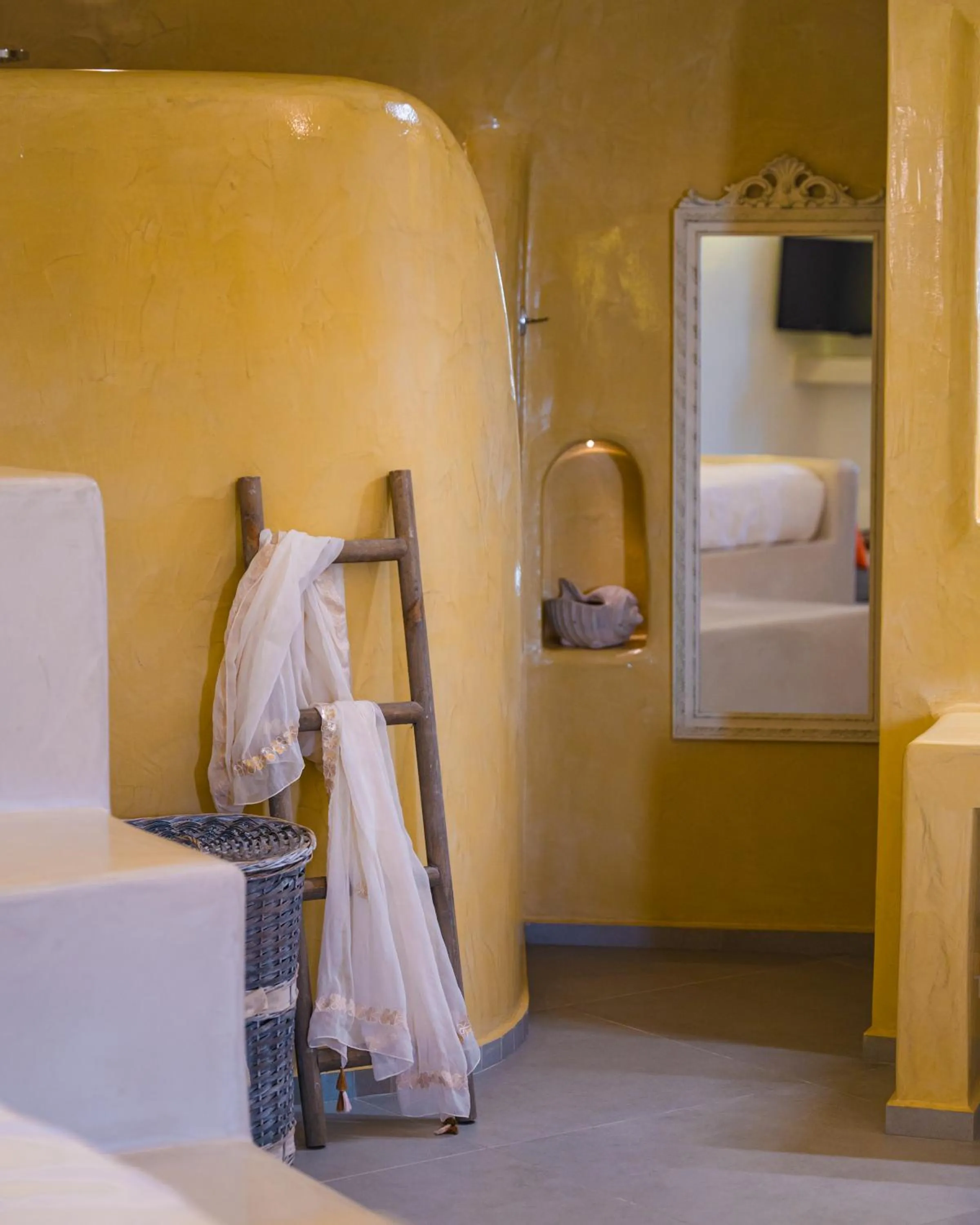 Bed in Santoterra Antigua Suites