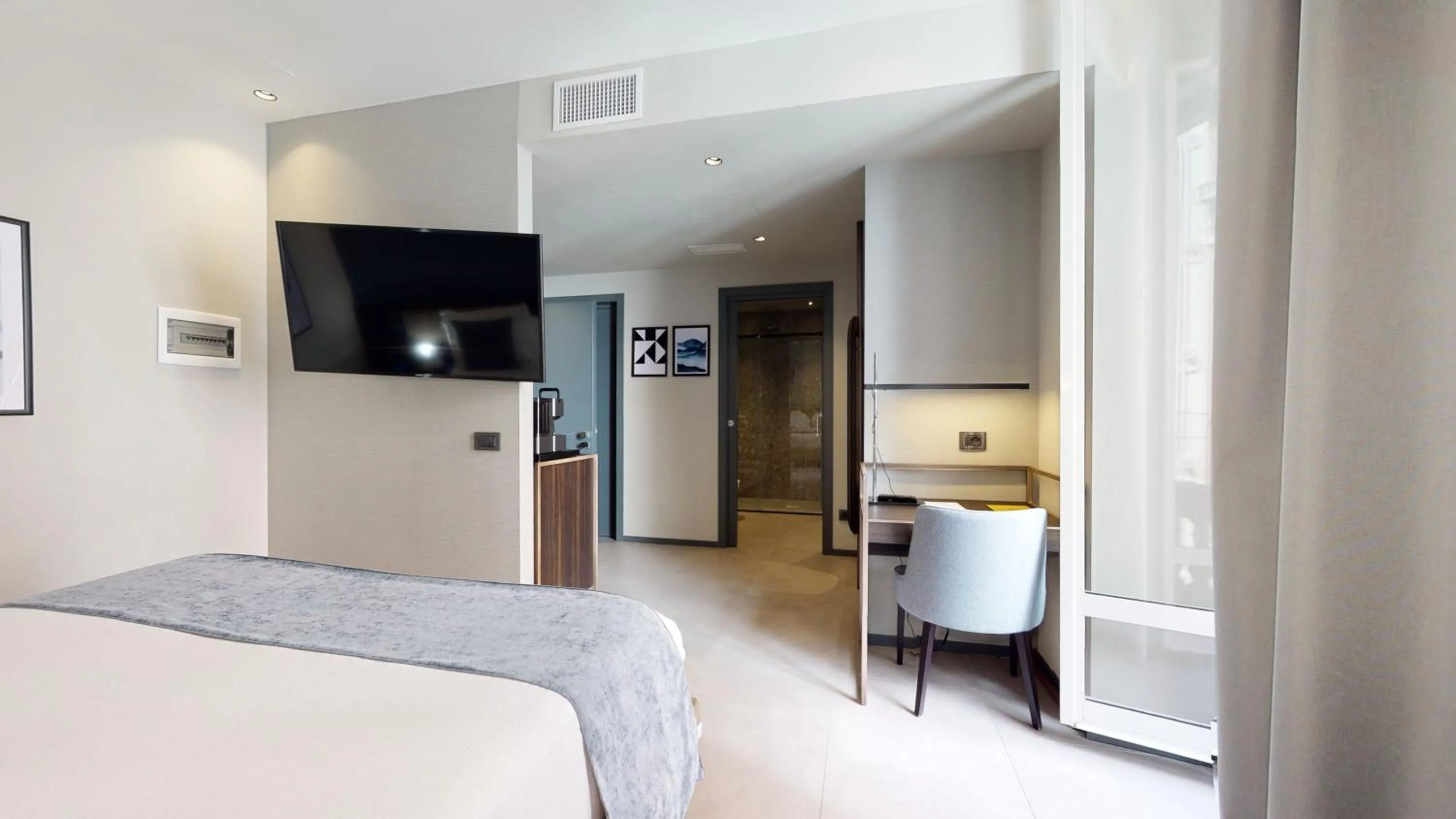 Seating area, Bed in GALLERIA The Smart Boutique APARTHOTEL By OSPITAMI