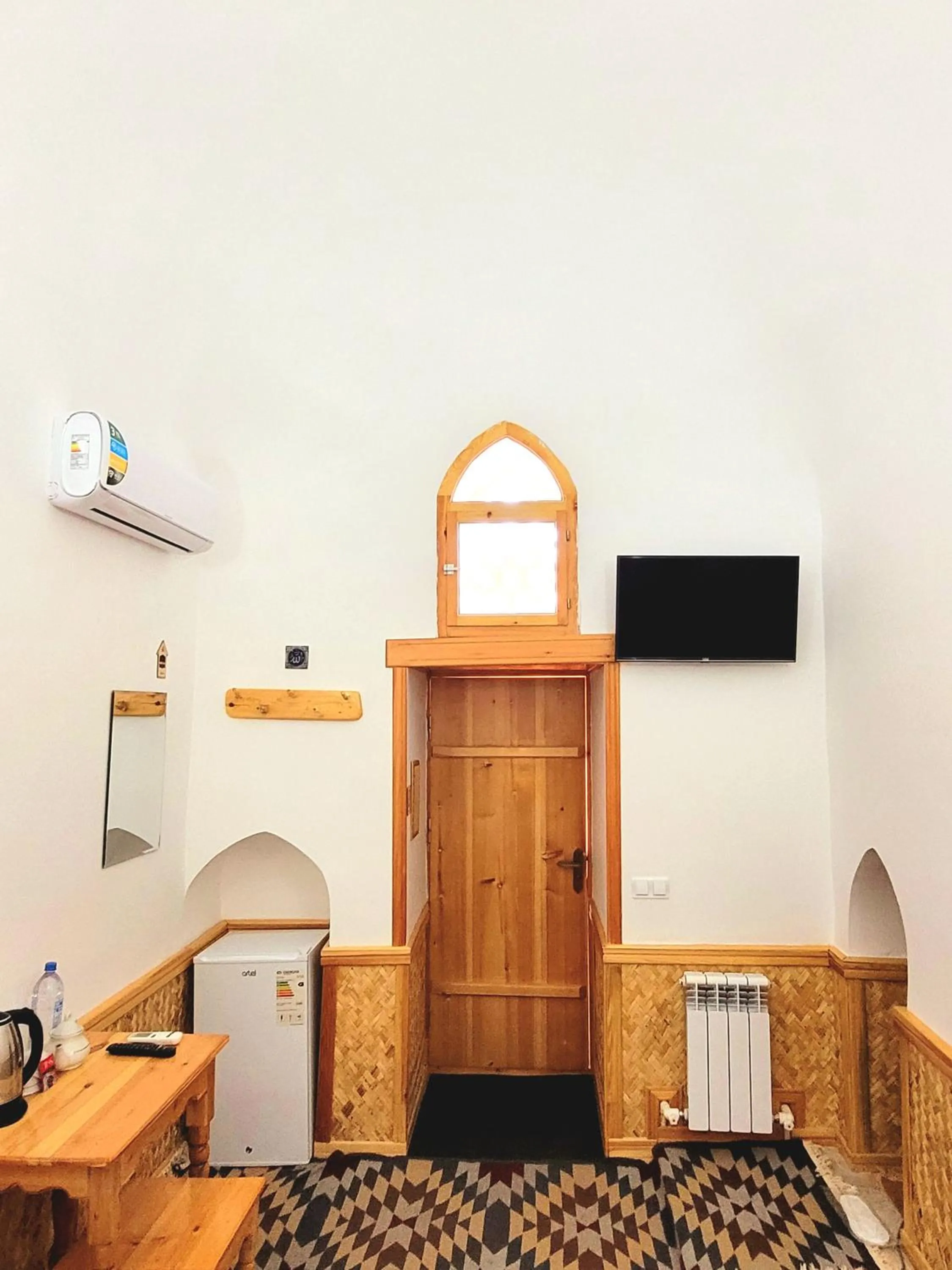 Decorative detail in madrasah Polvon-Qori boutique hotel XIX century