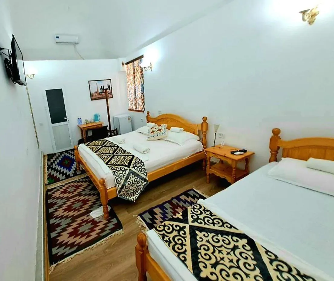Photo of the whole room, Bed in madrasah Polvon-Qori boutique hotel XIX century