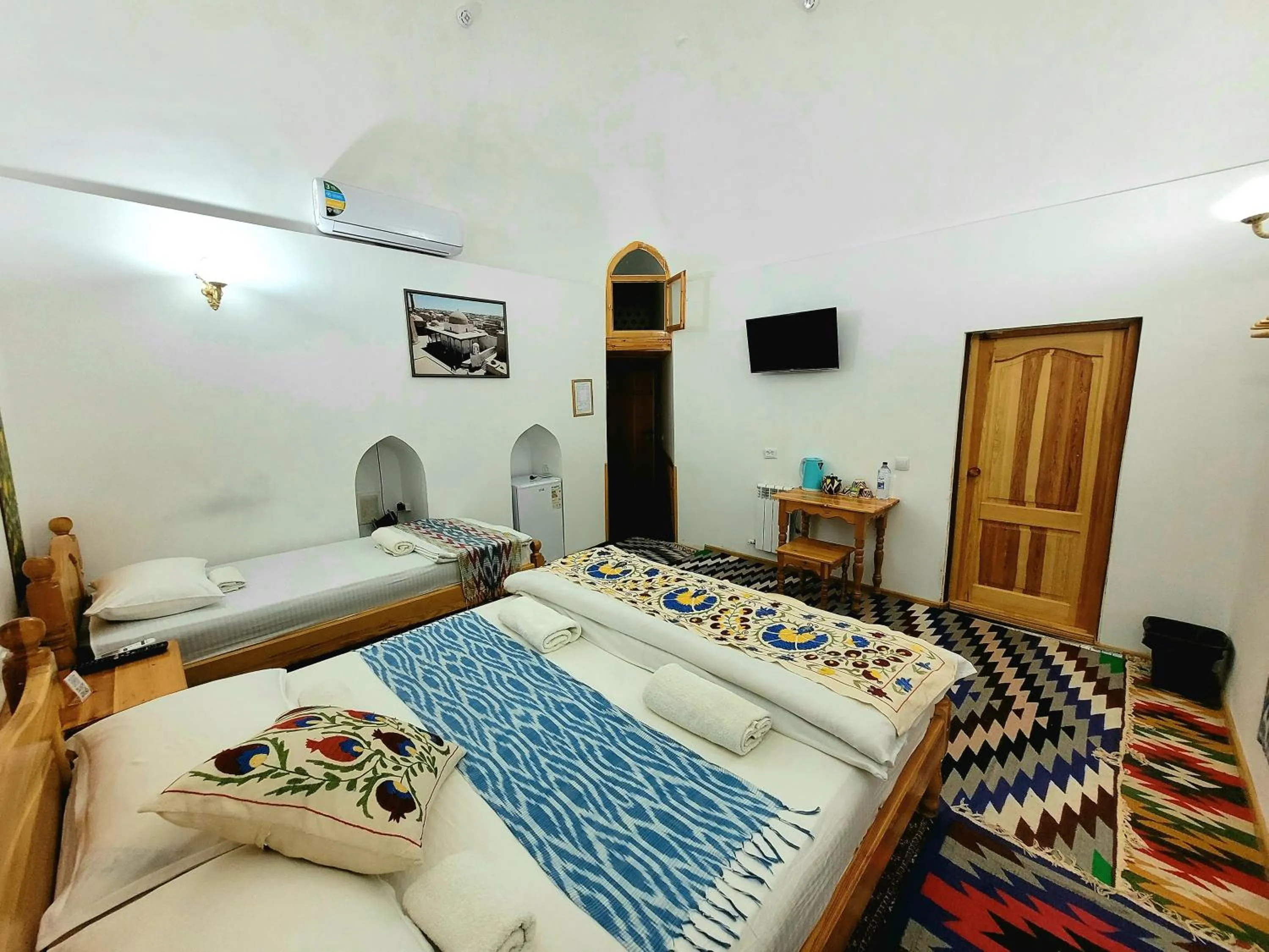 Bed in madrasah Polvon-Qori boutique hotel XIX century