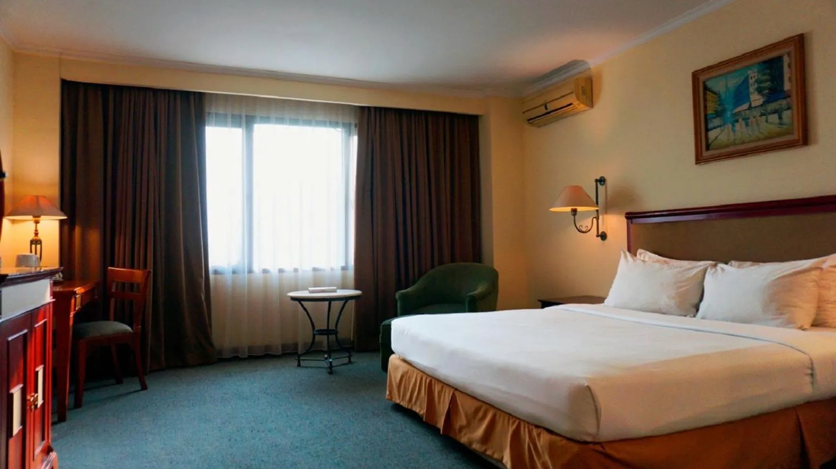 Photo of the whole room, Bed in Mega Anggrek Hotel Jakarta Slipi