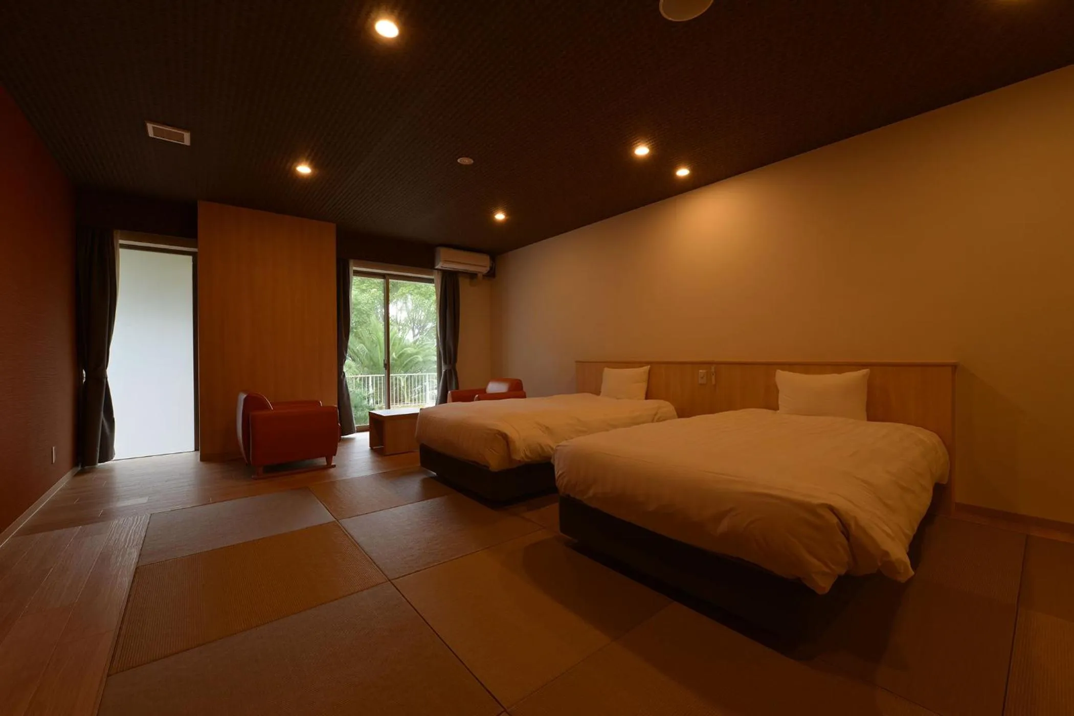 Bed in Ooedo Onsen Monogatari Hotel Suiyotei