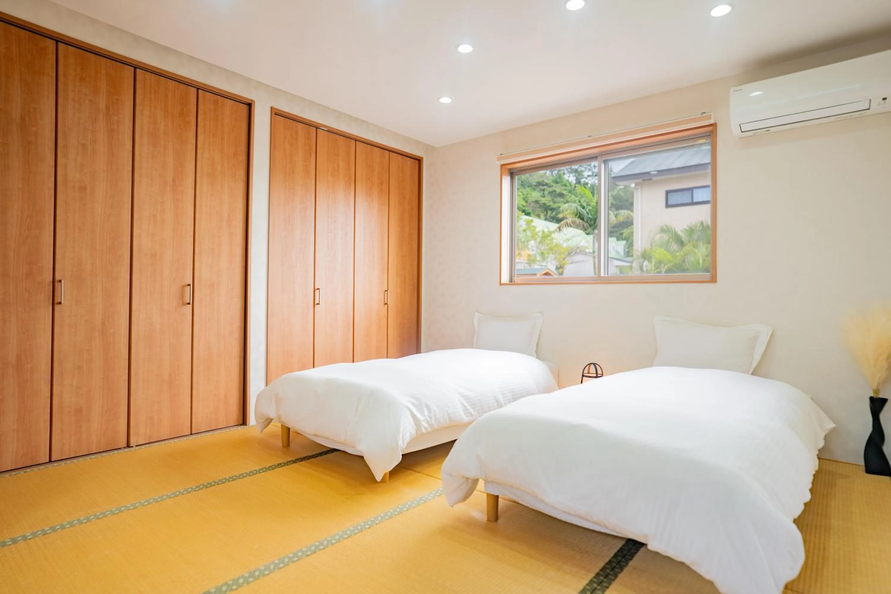 Bed in Yamagata Ryukyu Hatago Onnason with pool