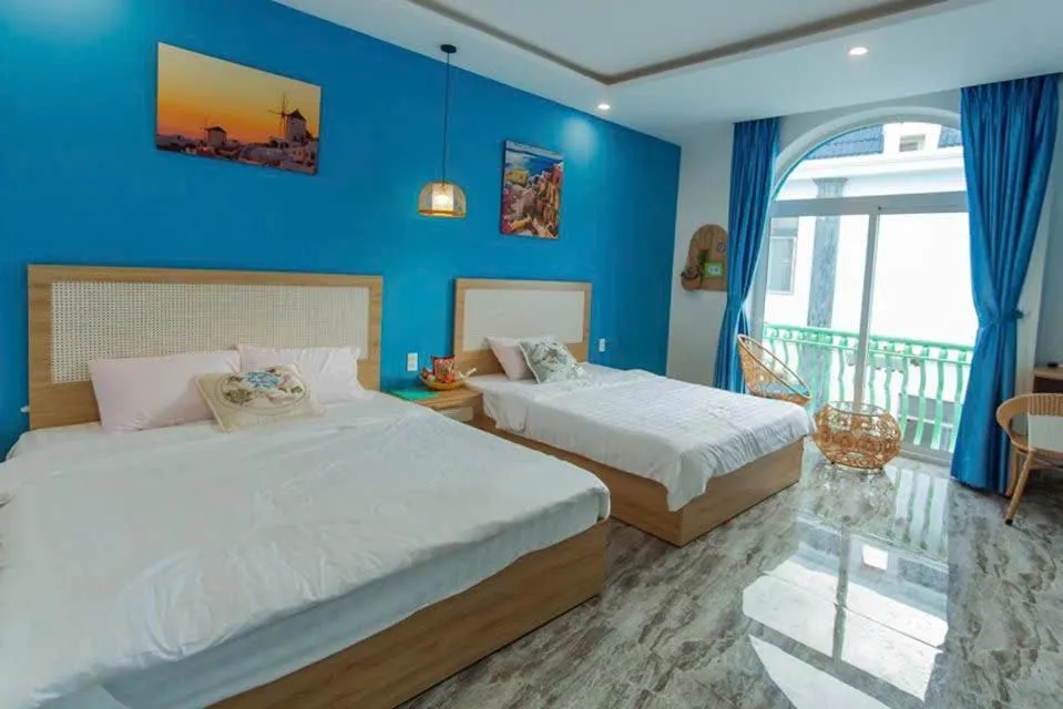 Bed in Santorini House and Coffee