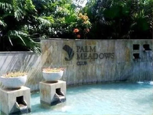 Property logo or sign in Palm Meadows Resort