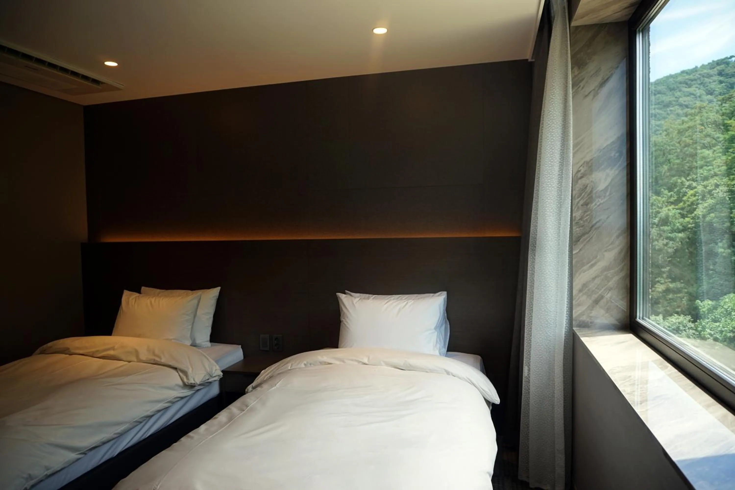 Bed in Mudeung Park Hotel