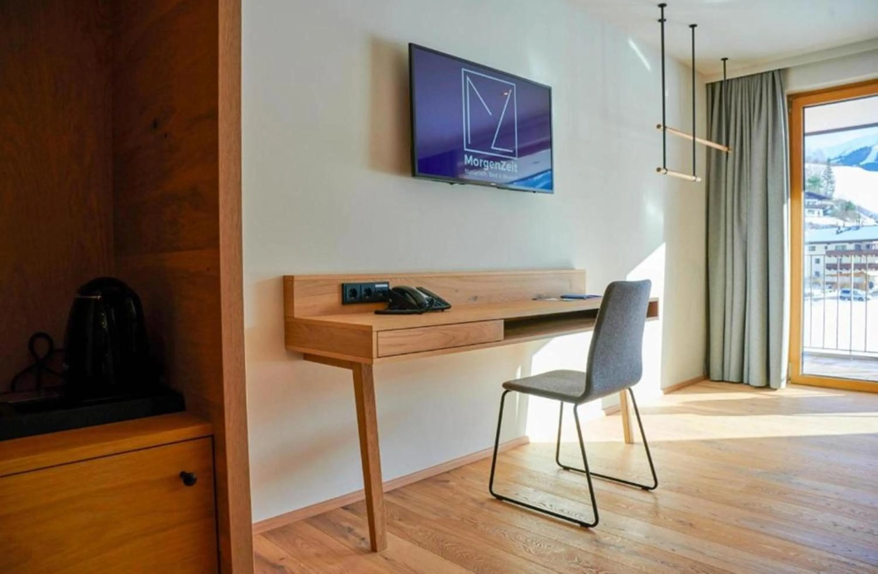 Photo of the whole room in Wellness und Brunch Hotel MorgenZeit beheizter Naturpool mit Sandstrand Genuss Frühstück bis 13 Uhr Hochkönig Sommercard