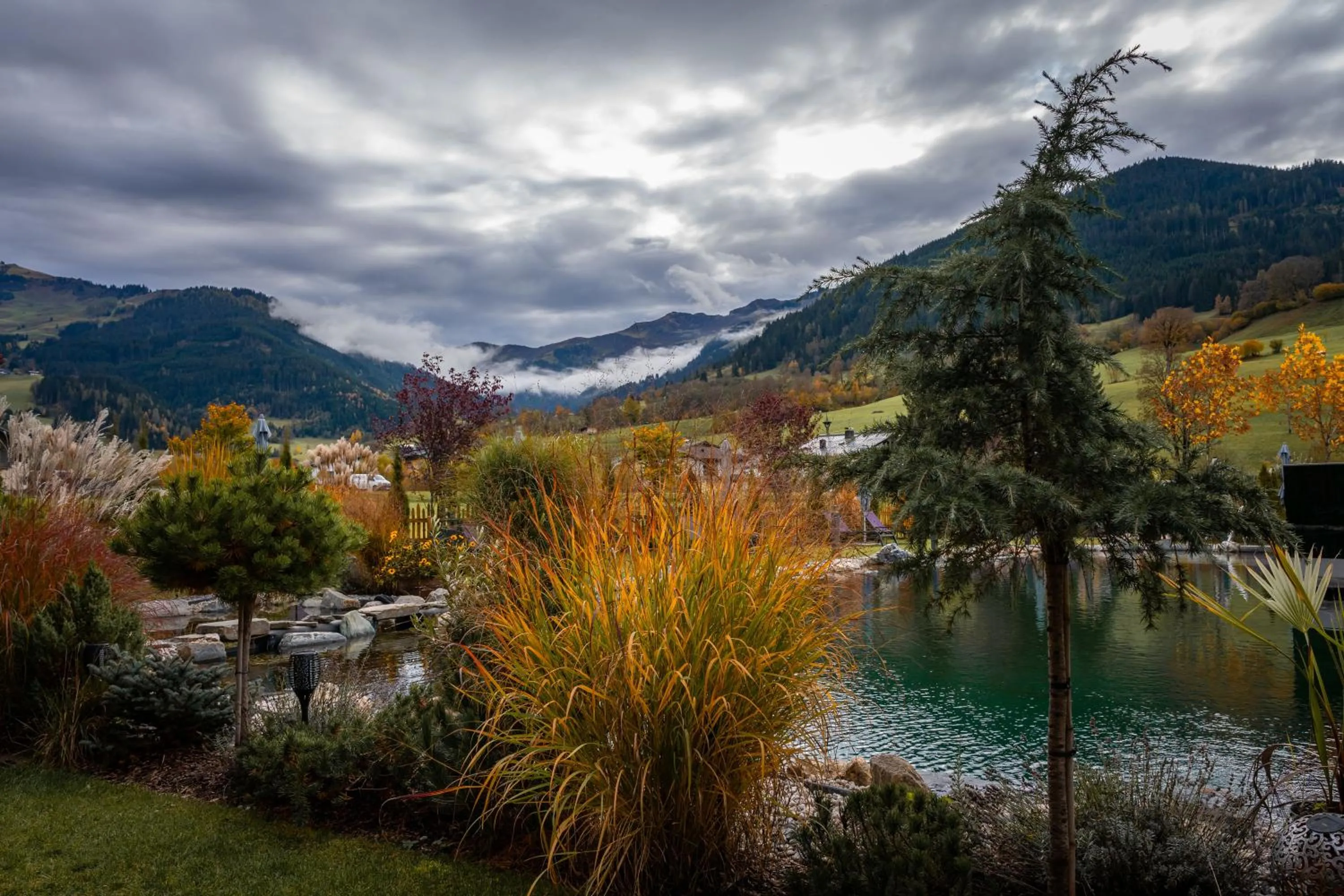 Natural landscape in Wellness und Brunch Hotel MorgenZeit beheizter Naturpool mit Sandstrand Genuss Frühstück bis 13 Uhr Hochkönig Sommercard