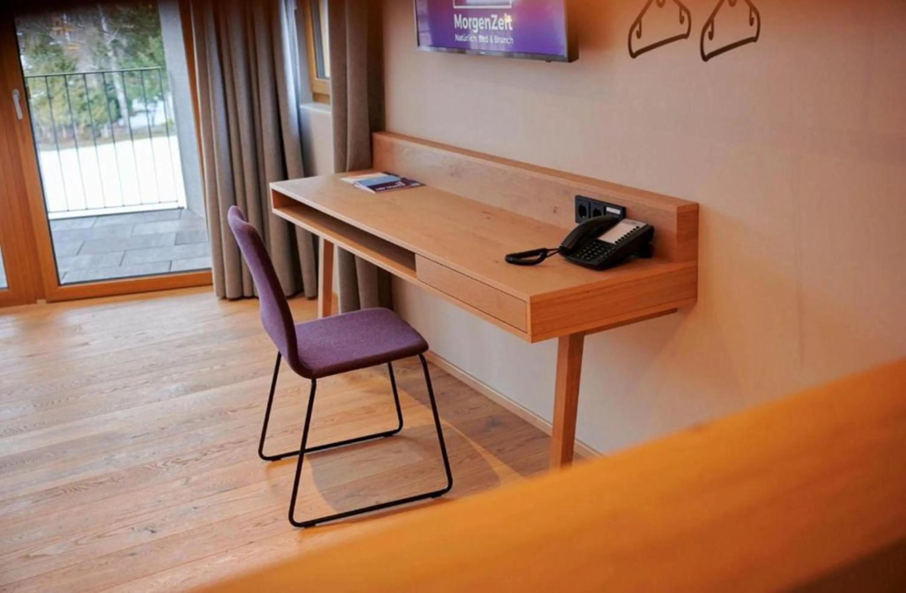 Photo of the whole room in Wellness und Brunch Hotel MorgenZeit beheizter Naturpool mit Sandstrand Genuss Frühstück bis 13 Uhr Hochkönig Sommercard