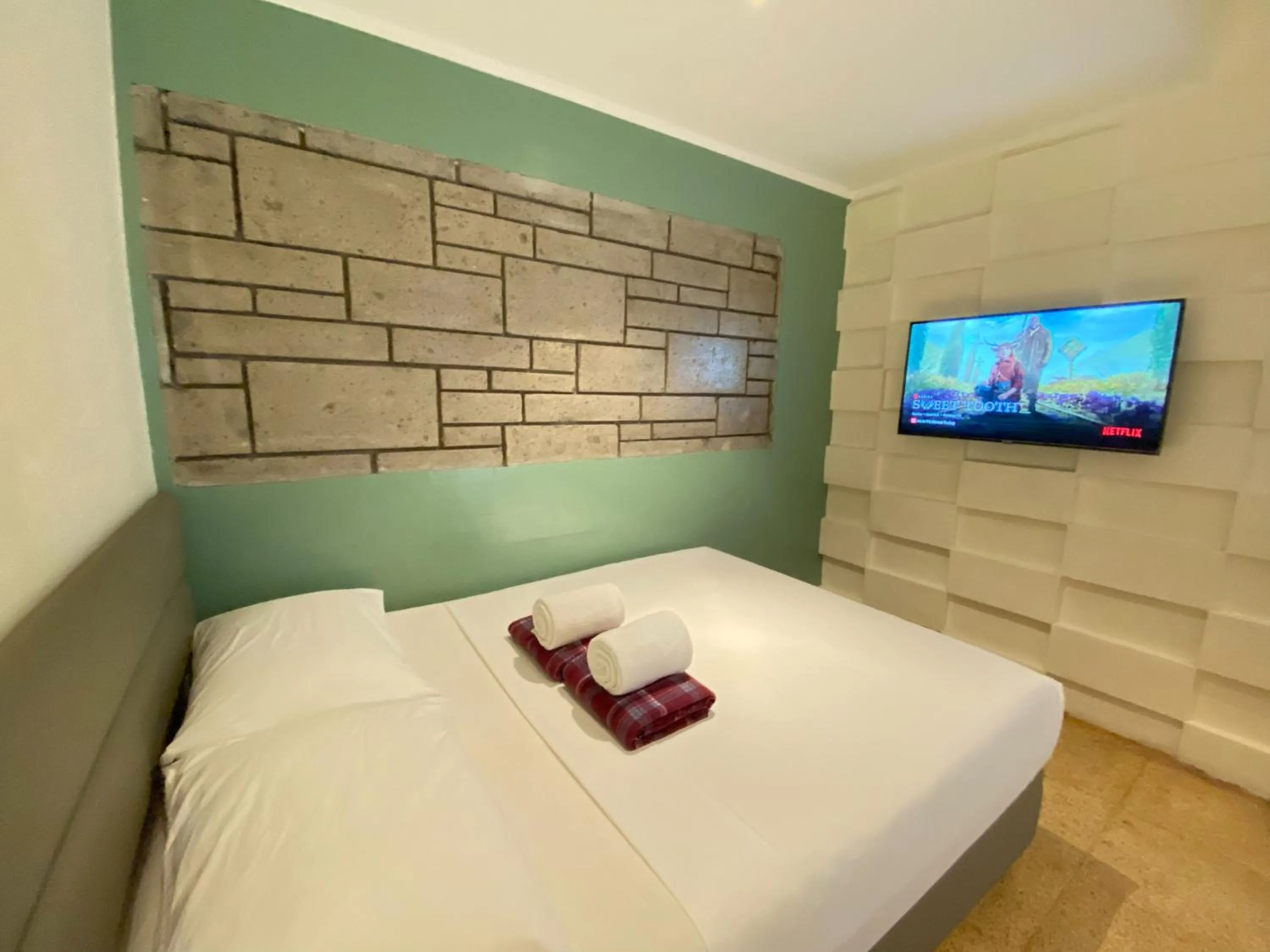 Bed in The Hub District Garden Suites