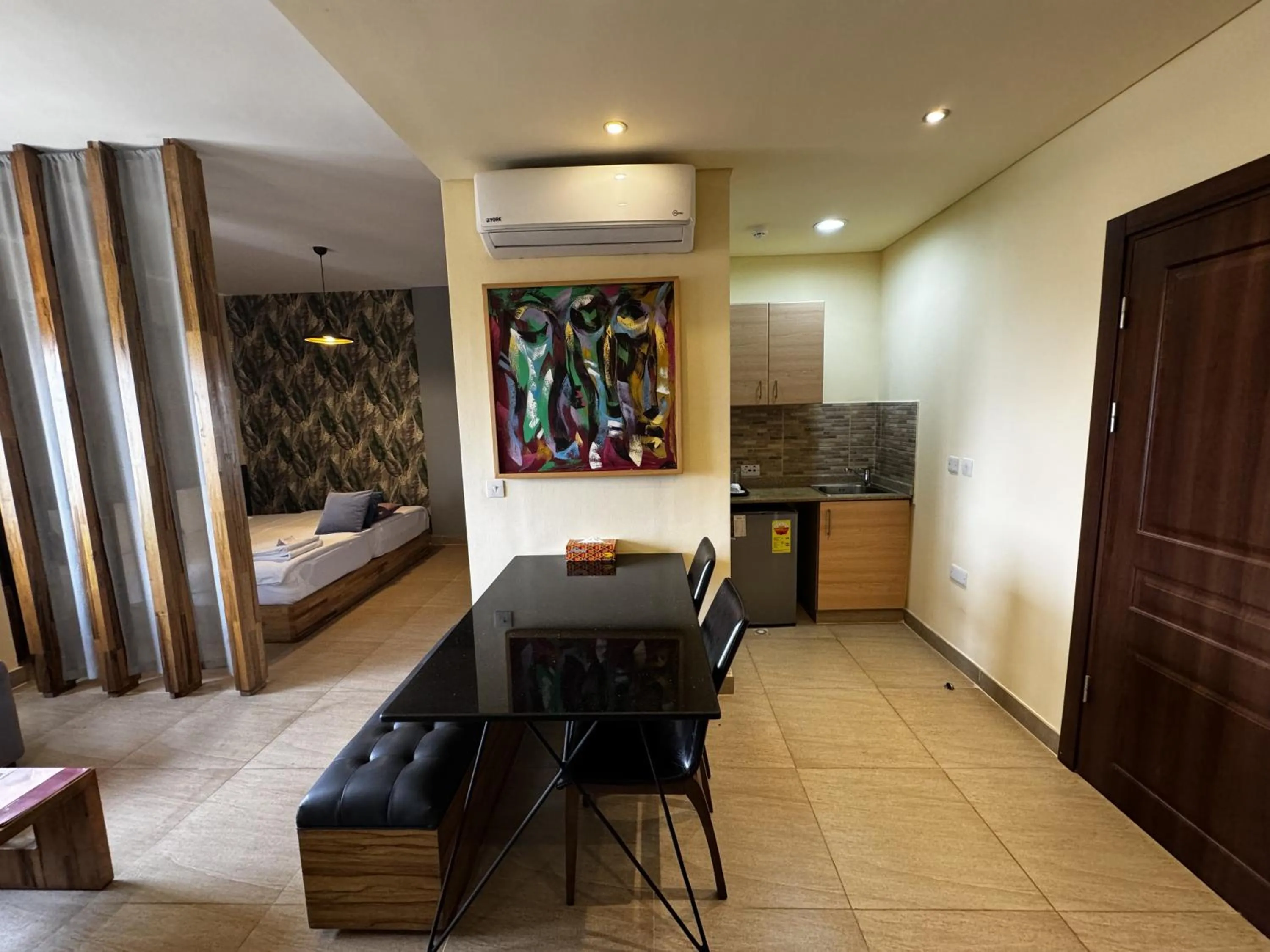 Bed in Roots Hotel Apartment