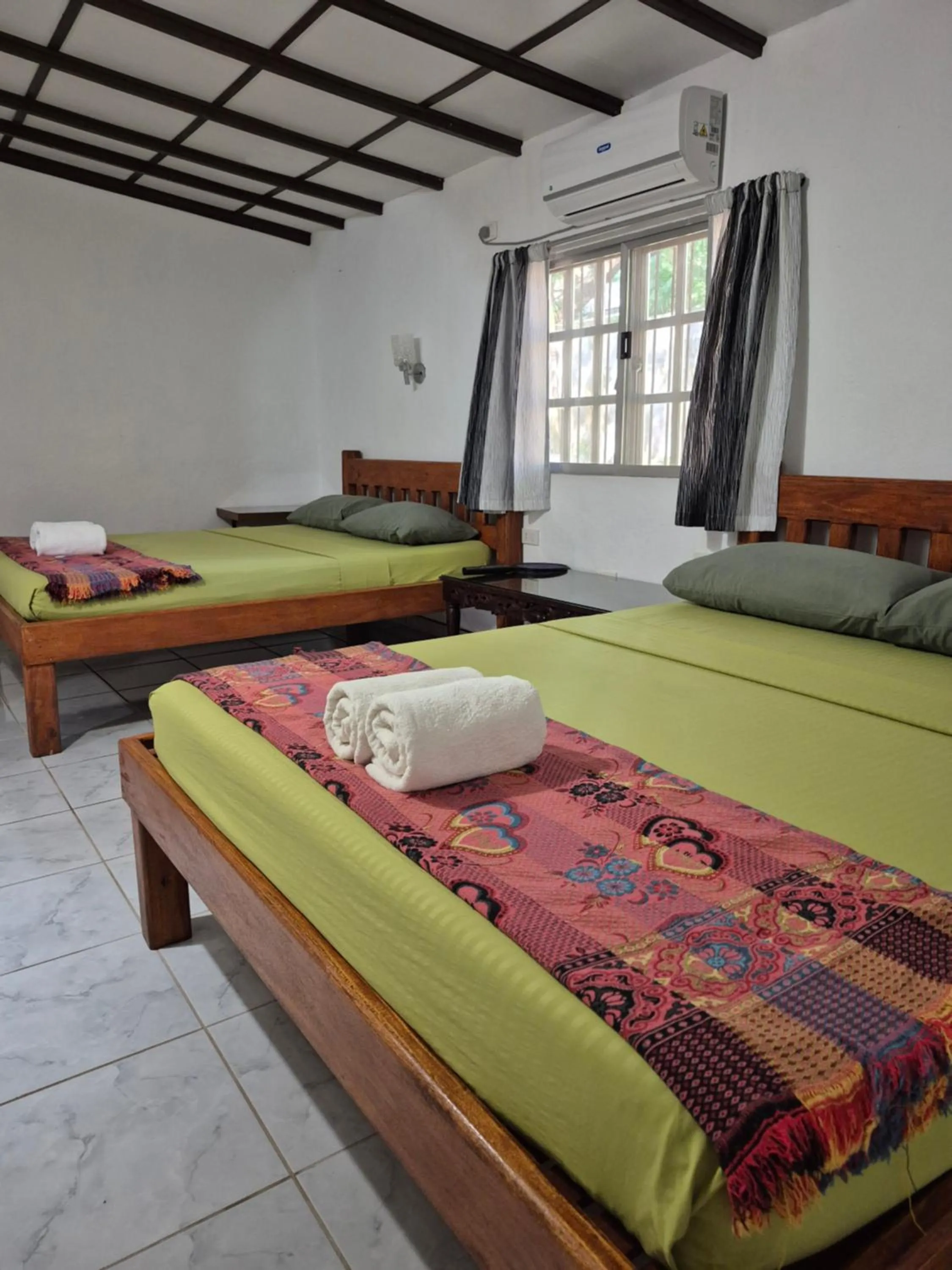 Bed in ALONALAND RESORT