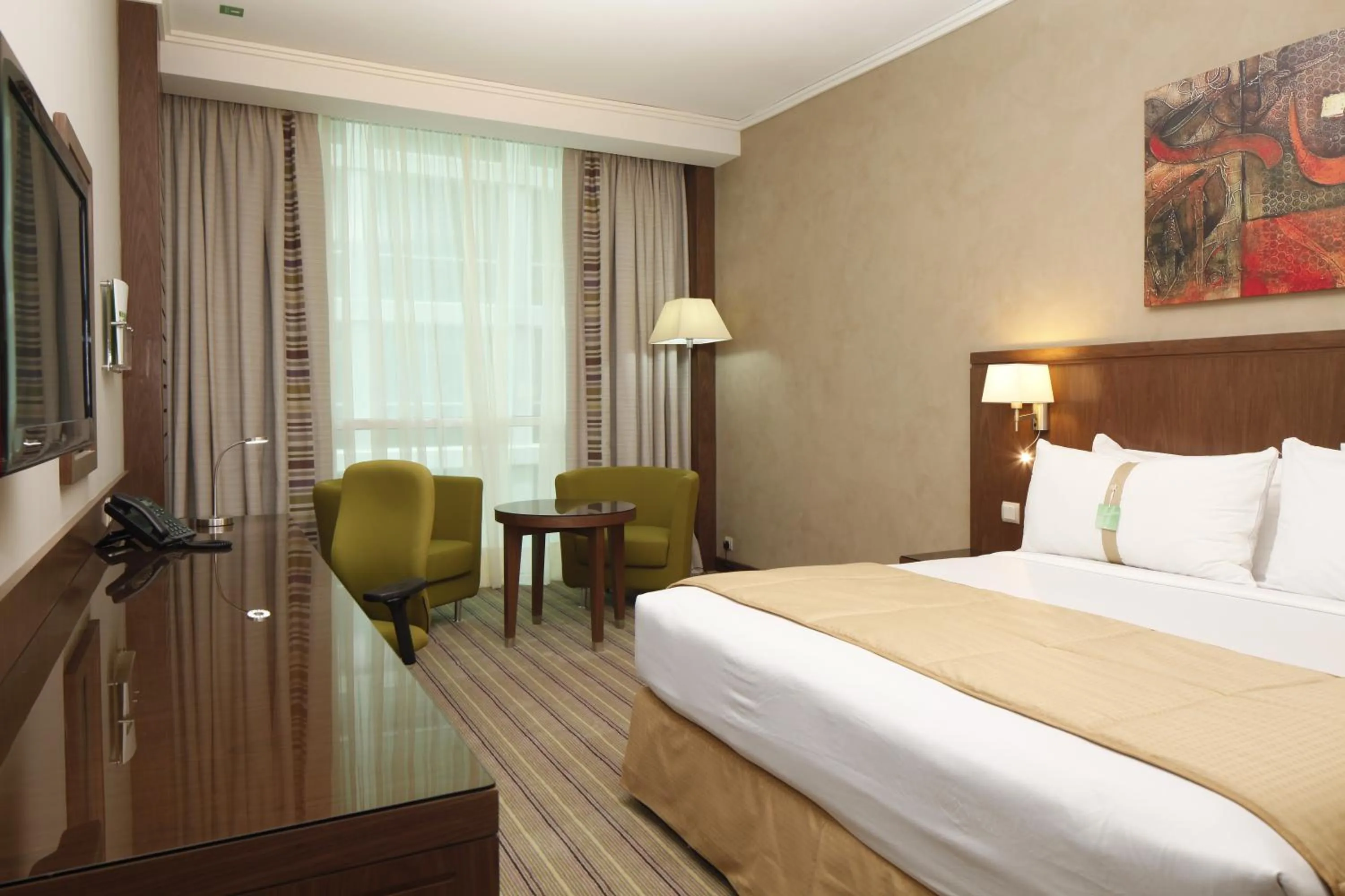 Bed in Holiday Inn Meydan, an IHG Hotel