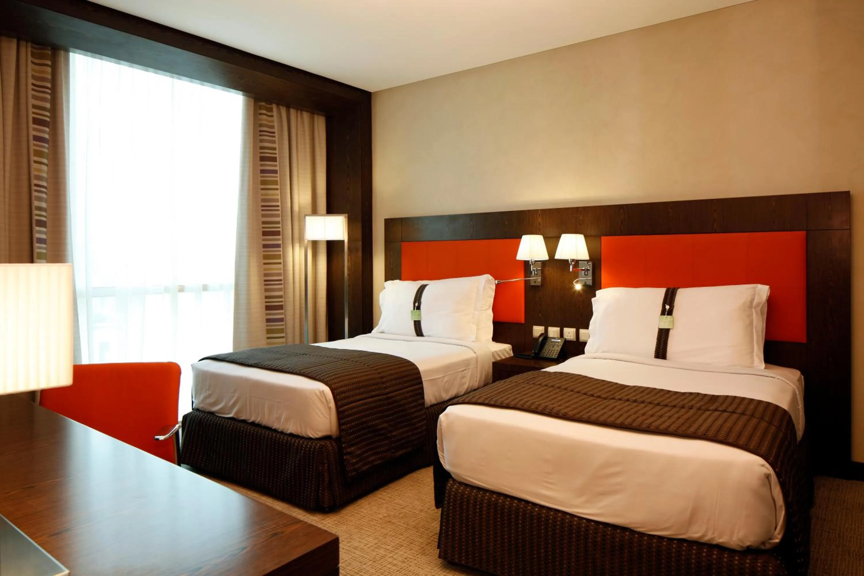 Bed in Holiday Inn Meydan, an IHG Hotel