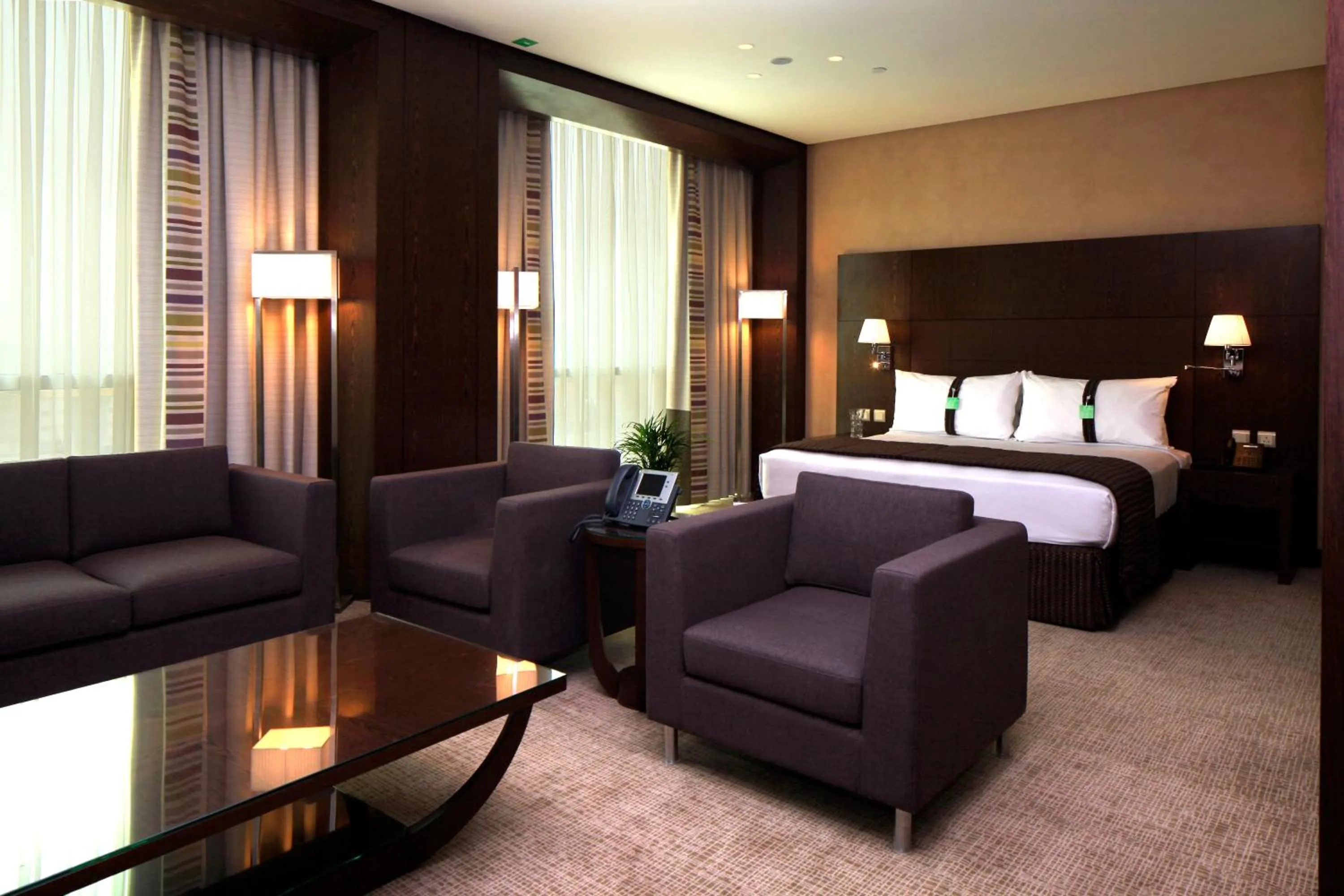 Seating area, Bed in Holiday Inn Meydan, an IHG Hotel